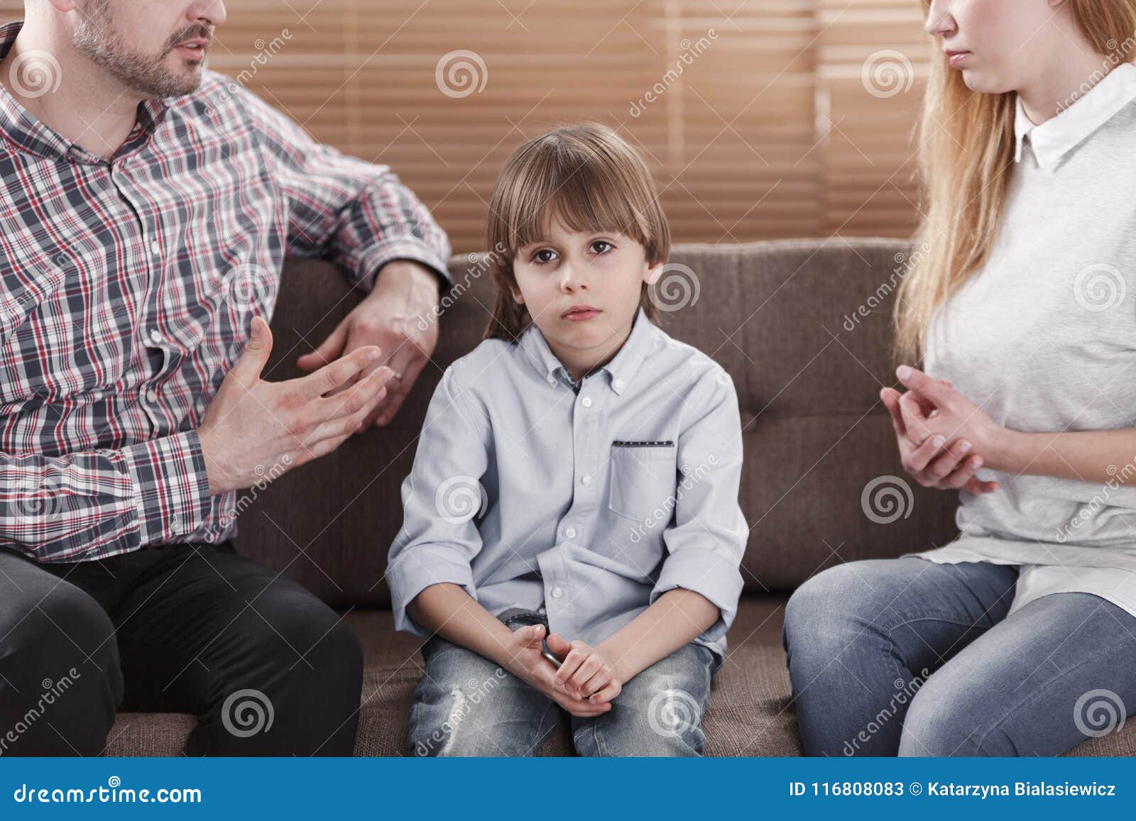 sad child while parents arguing