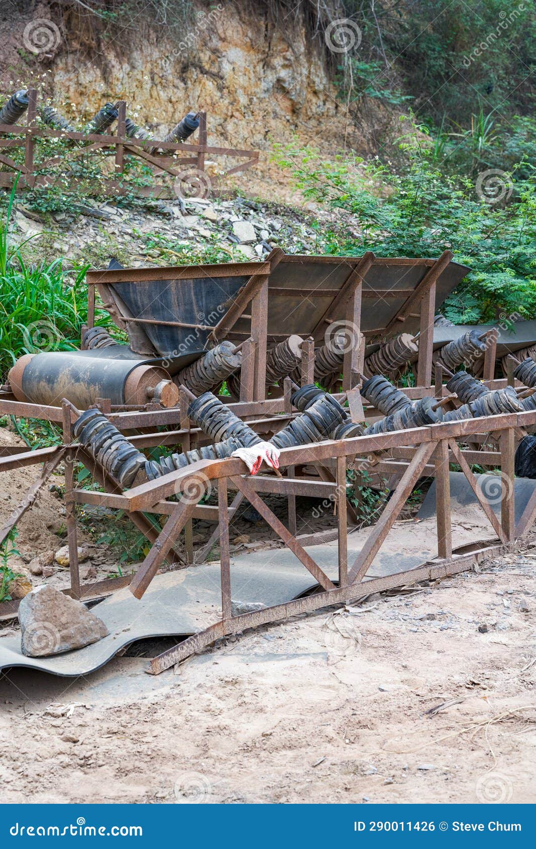 Closeup of Sand Mining Equipment by the River Beach Stock Photo