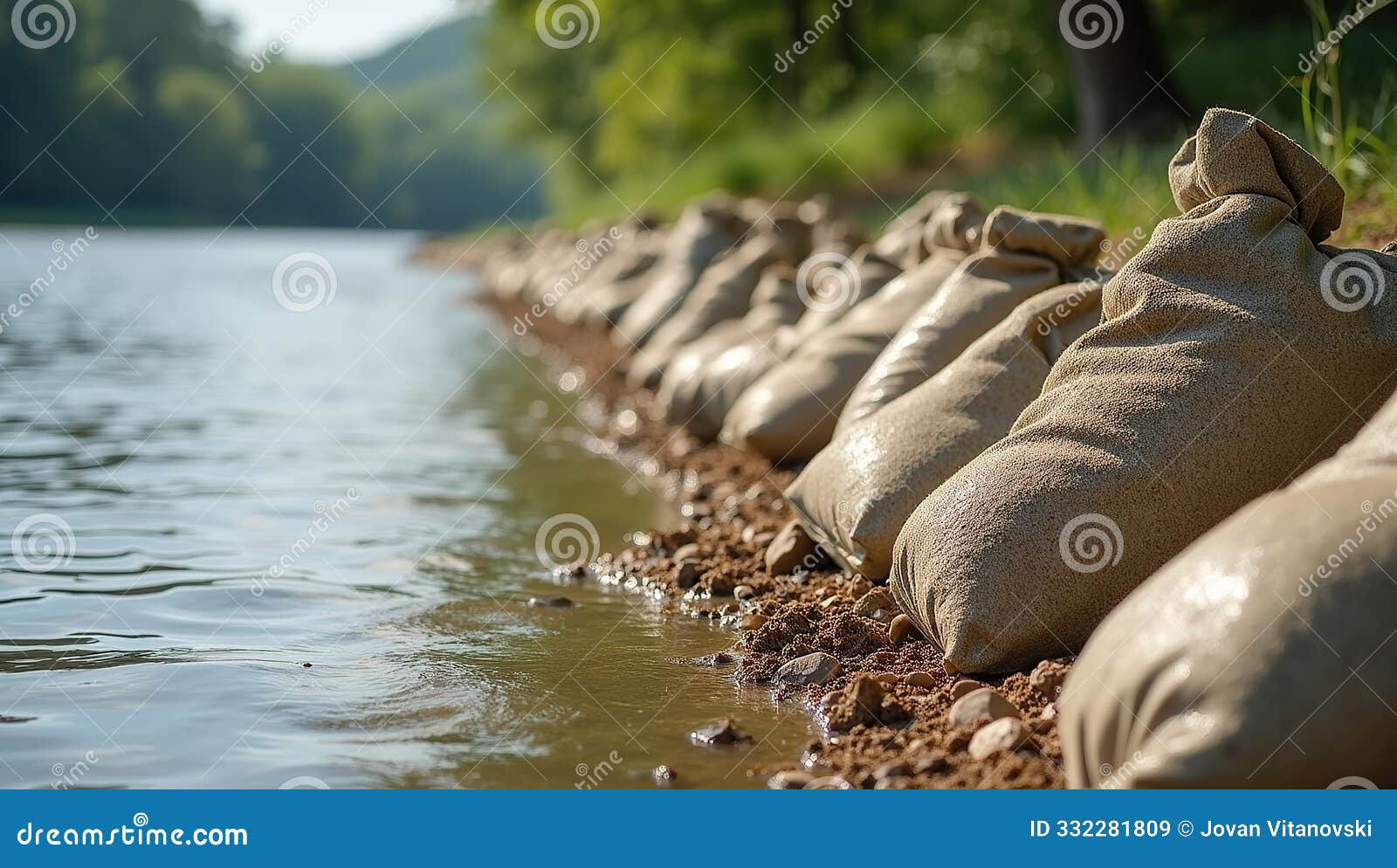 close-up of sandbags along riverbank for flood prevention and water management