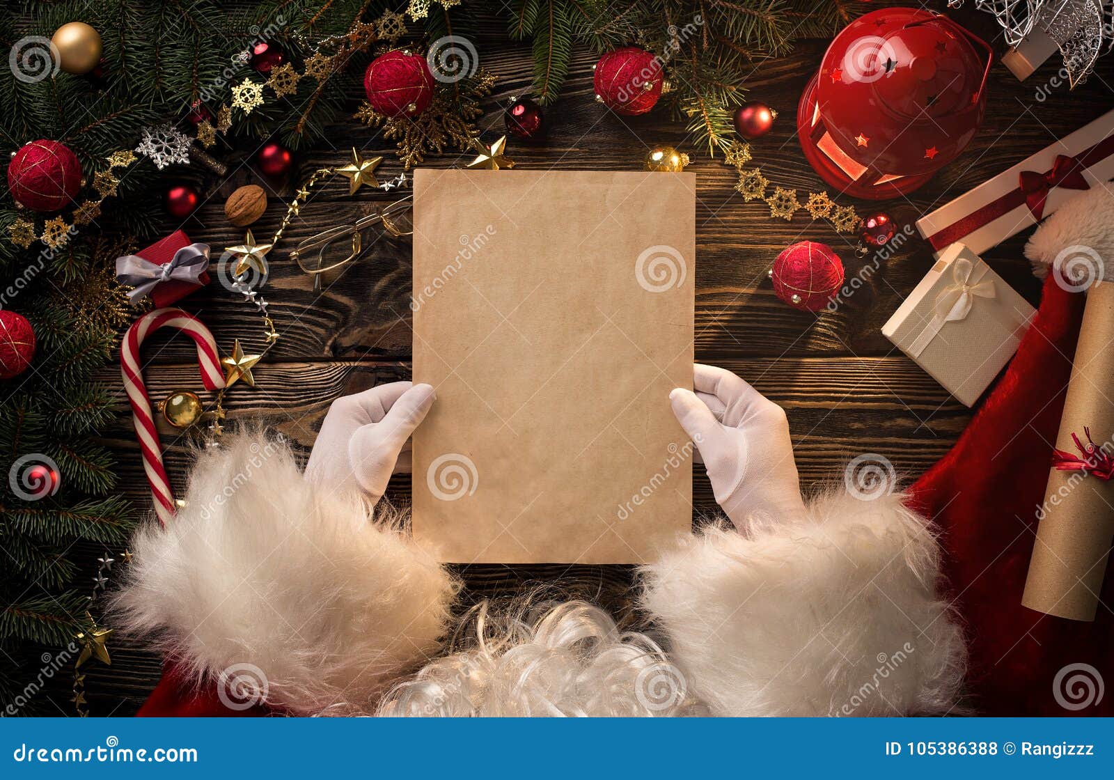 santa claus hands holding blank letter