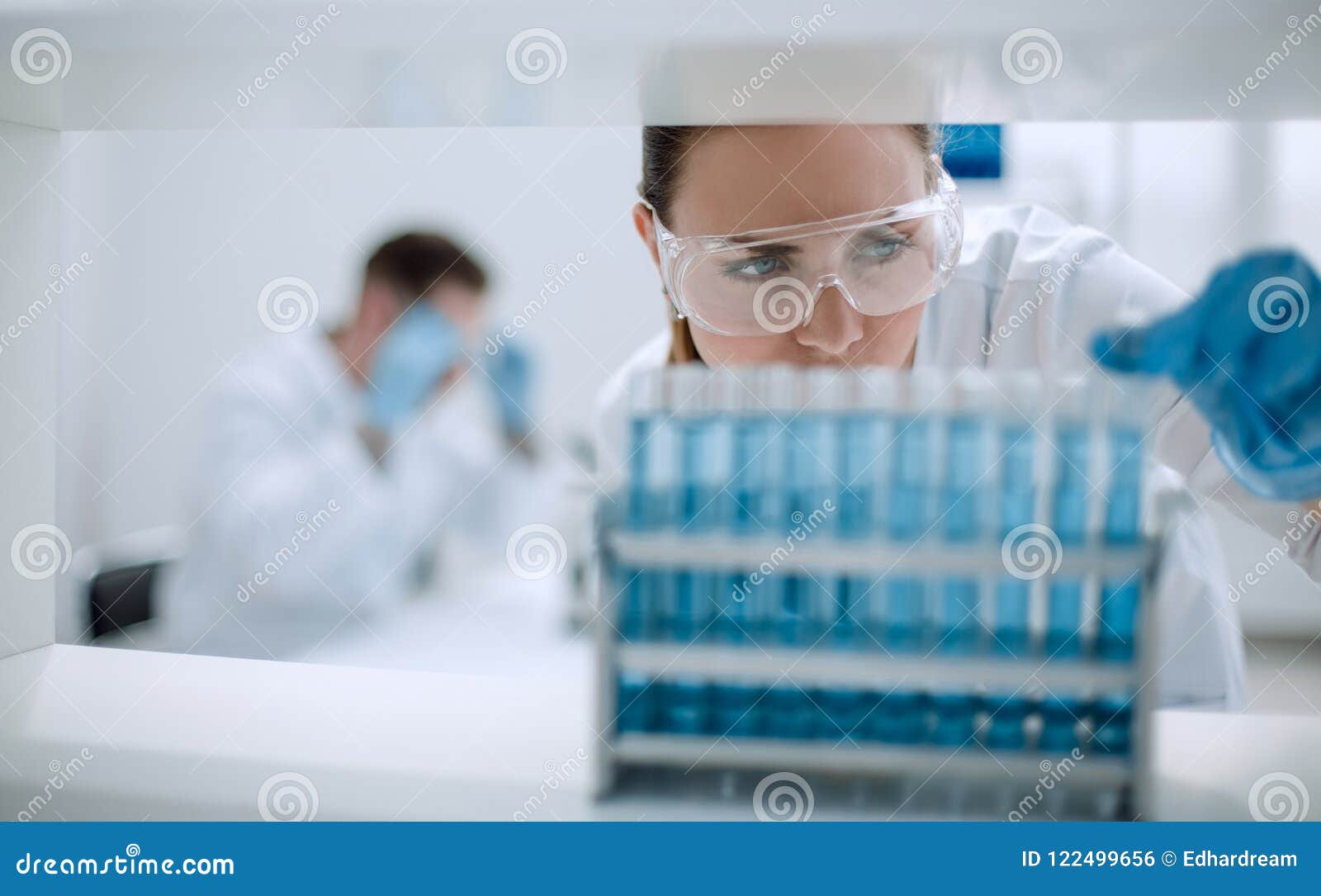 close up.scientist with vial