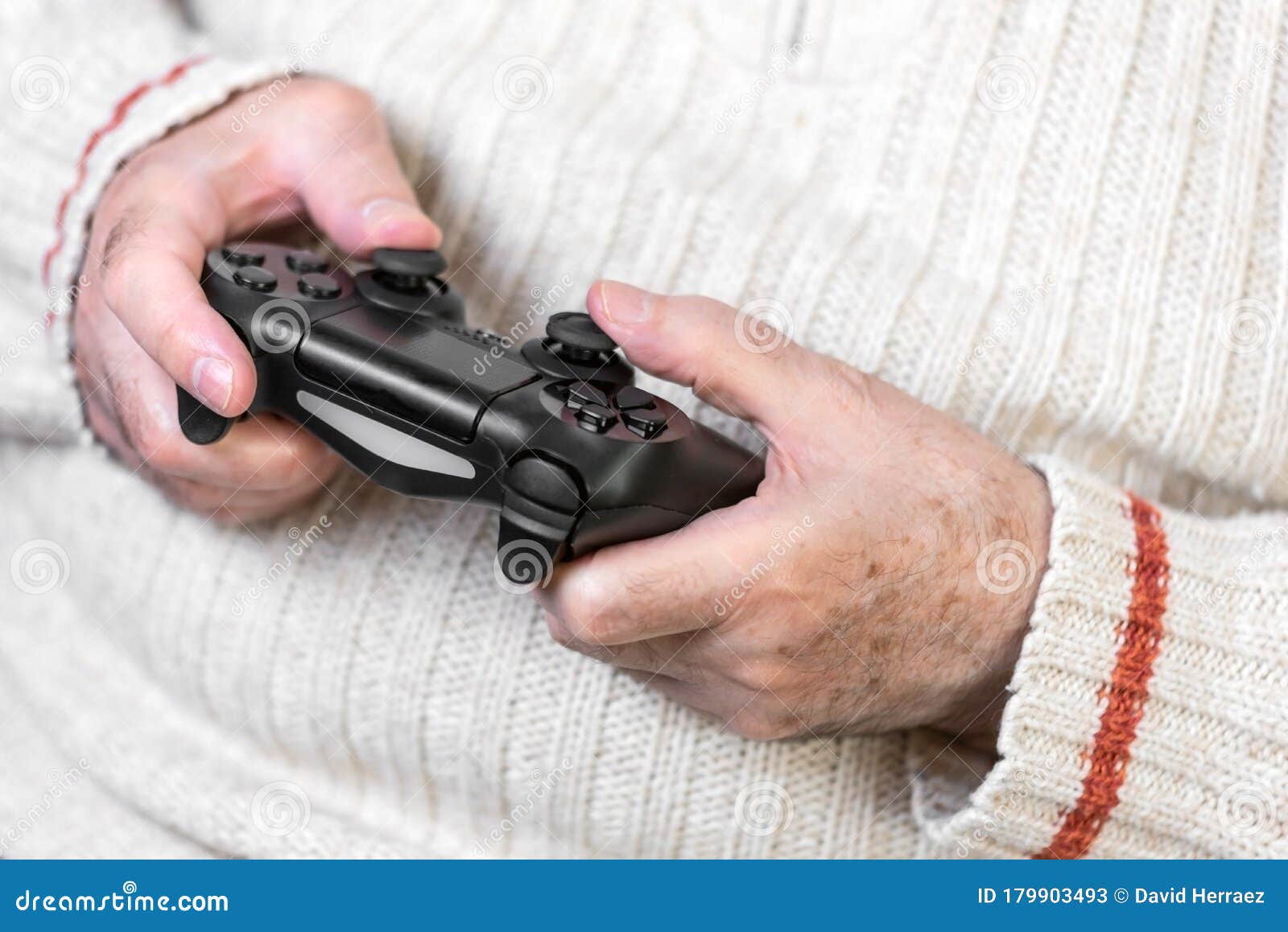 Closeup of Senior Hand Holding Video Game Controller. Stock Image