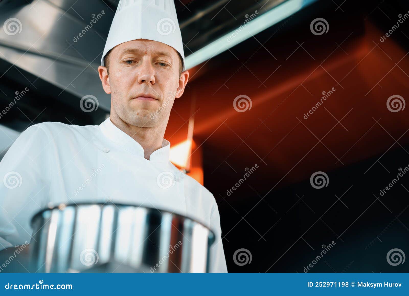 Closeup of a Seriousfaced Chef Working in a Professional Restaurant