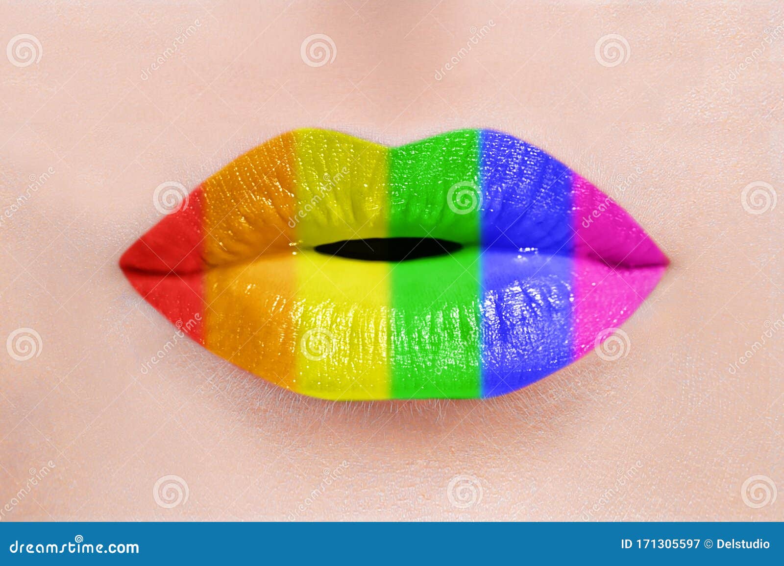 close up of sexy caucasian woman perfect lips with rainbow lipstick. lgbt, lesbian love and pride concept