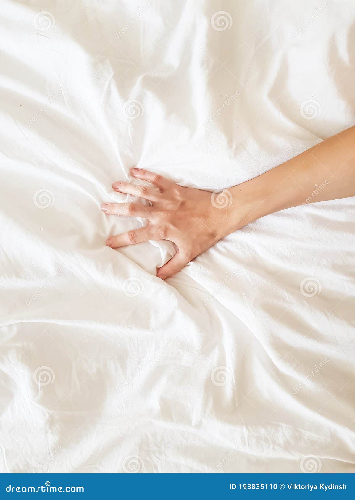 Close Up Woman Hand Pulling and Squeezing White Sheets in Ecstasy in image