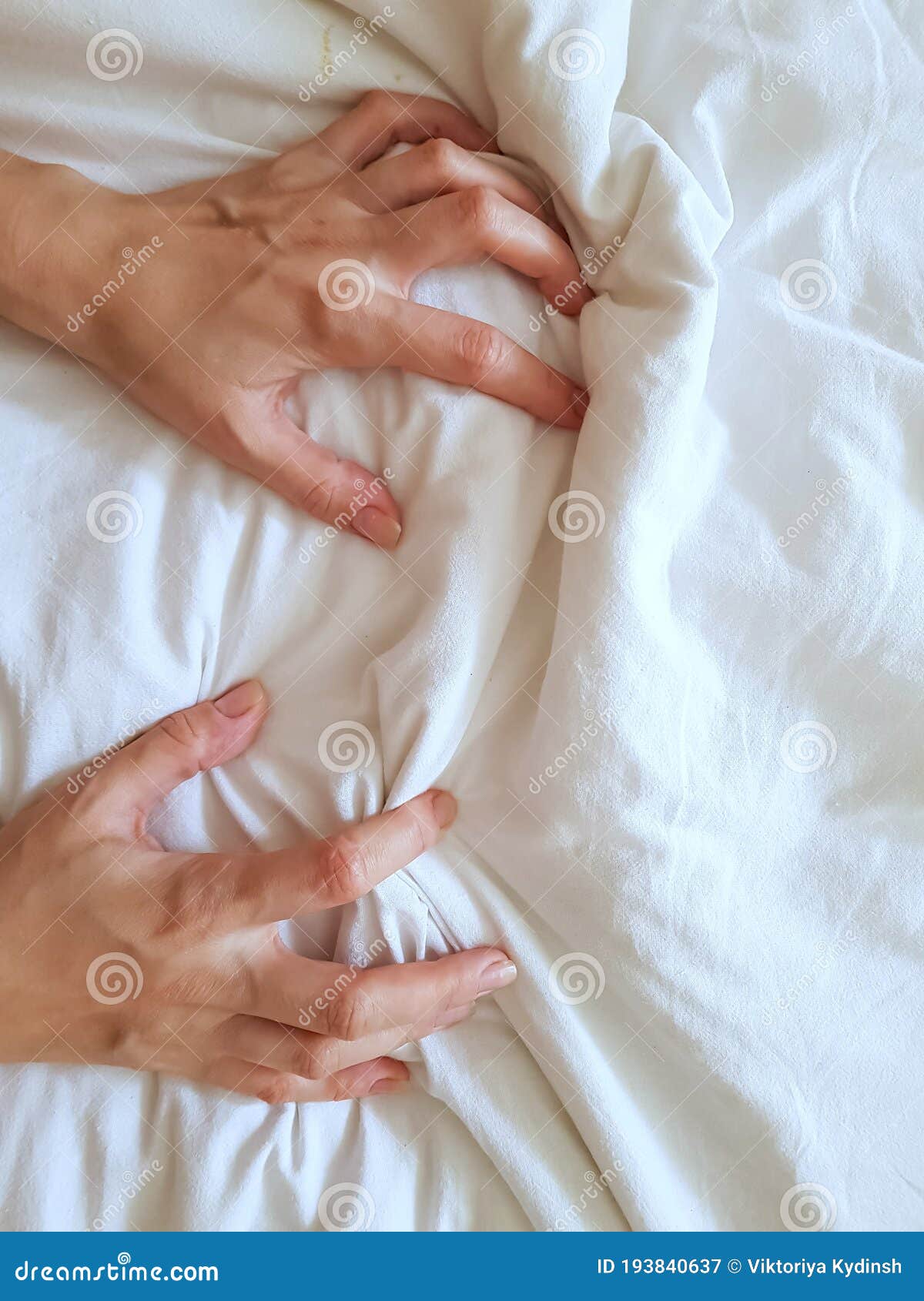 Close Up Woman Hand Pulling and Squeezing White Sheets in Ecstasy in