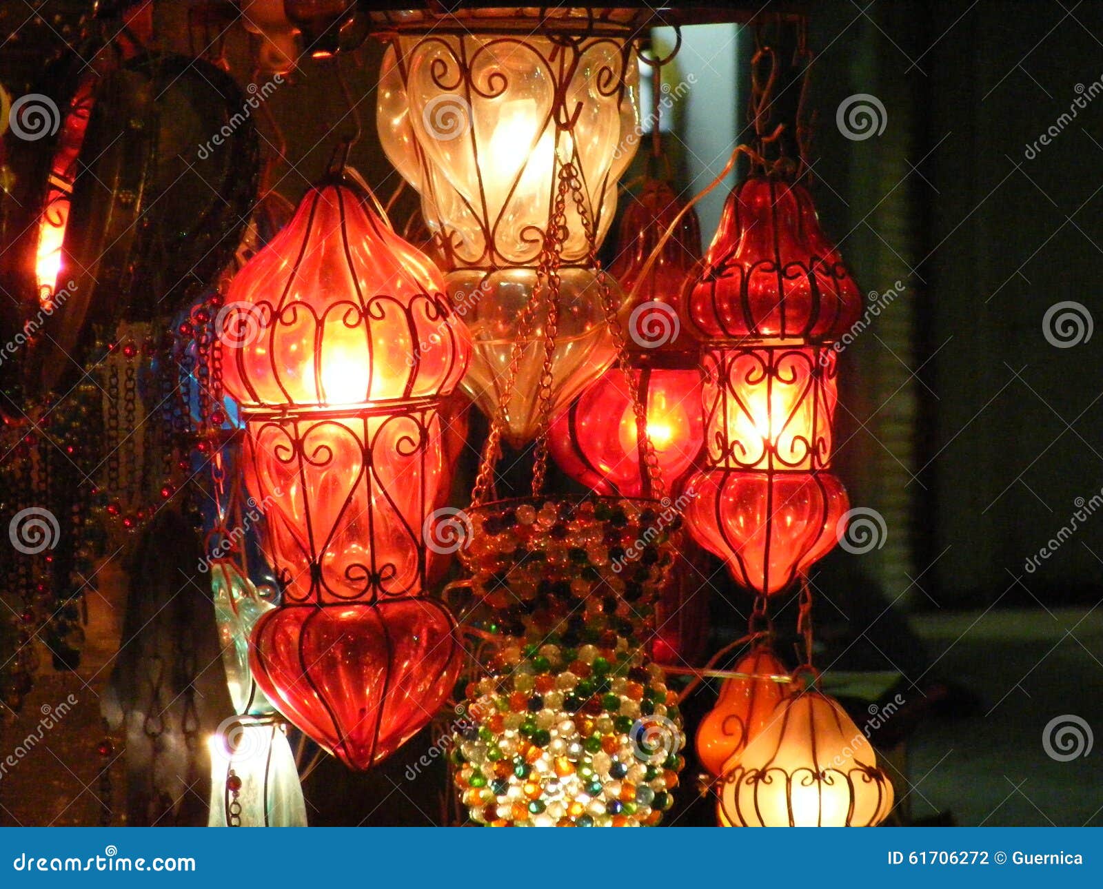 close up of shining lanterns in khan el khalili souq market with arabic handwriting on it in egypt cairo
