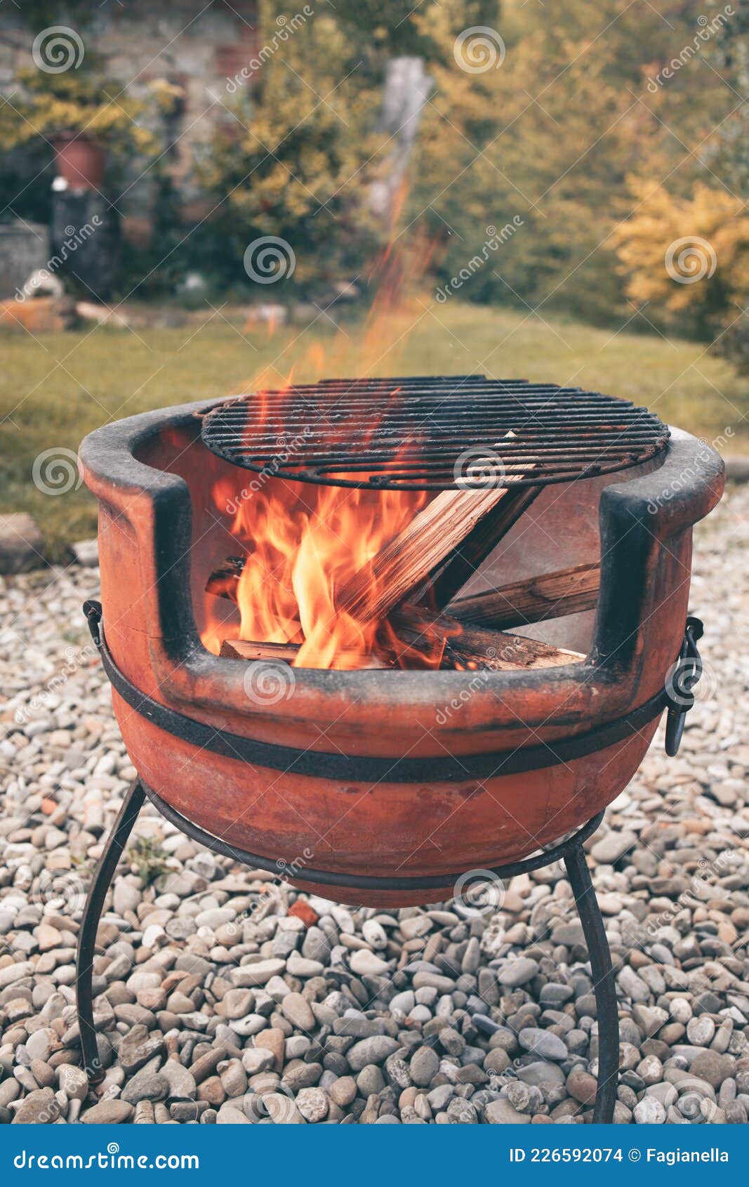 https://thumbs.dreamstime.com/z/close-up-shot-beautiful-vintage-terracotta-barbecue-pit-lit-up-firewood-burning-to-make-embers-coal-italian-style-226592074.jpg