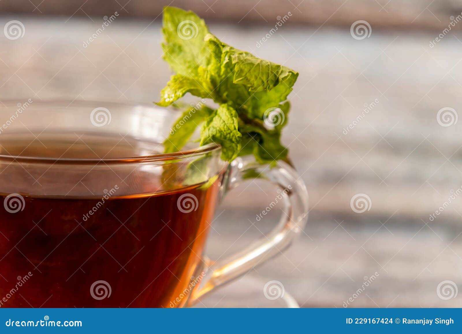 Close Up Shot of Black Tea with Mint Leaves on Defocused Background