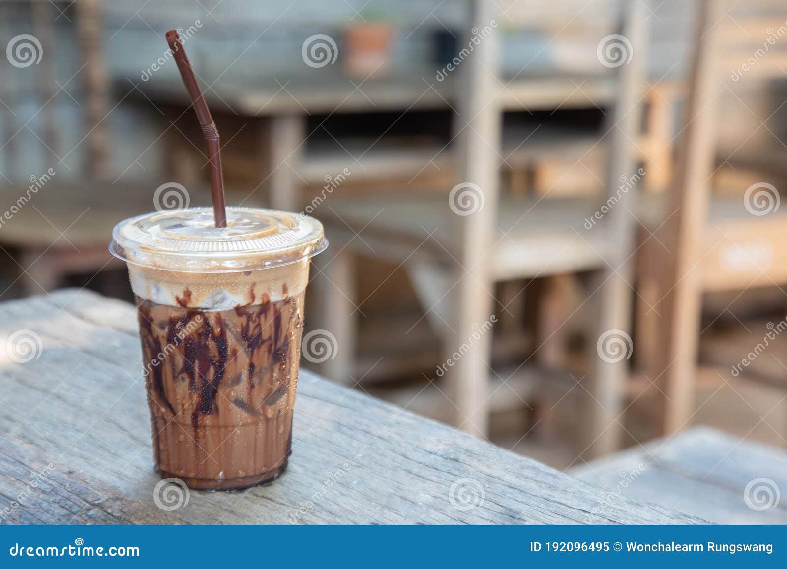 https://thumbs.dreamstime.com/z/close-up-shot-blurred-background-iced-beverage-chocolate-cocoa-mocha-coffee-clear-plastic-cup-put-vintage-wooden-192096495.jpg