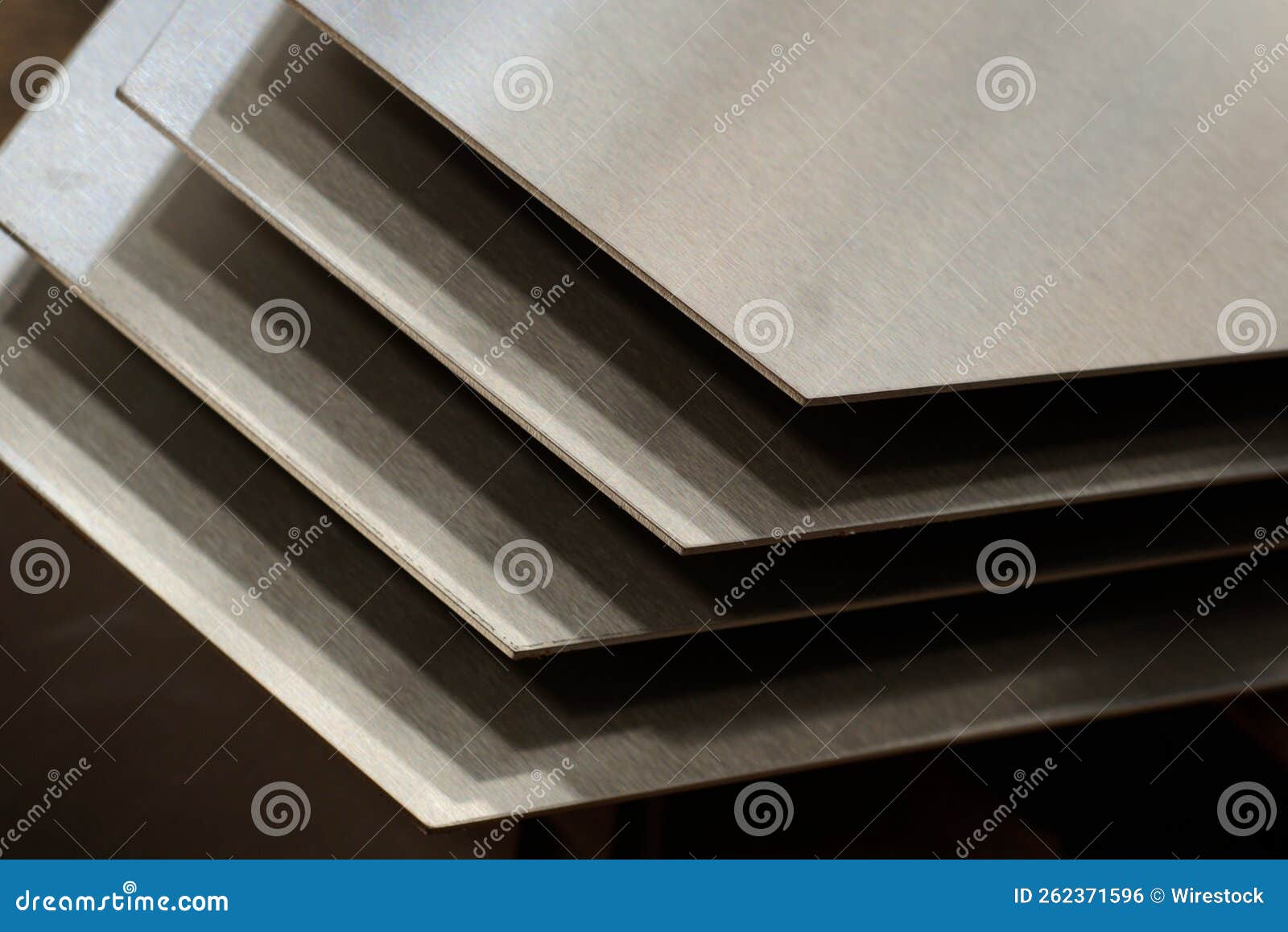 Close-up Shot of Cut Metal Shiny Silver Sheets Forming an Abstract  Geometric Design Stock Photo - Image of stack, light: 262371596