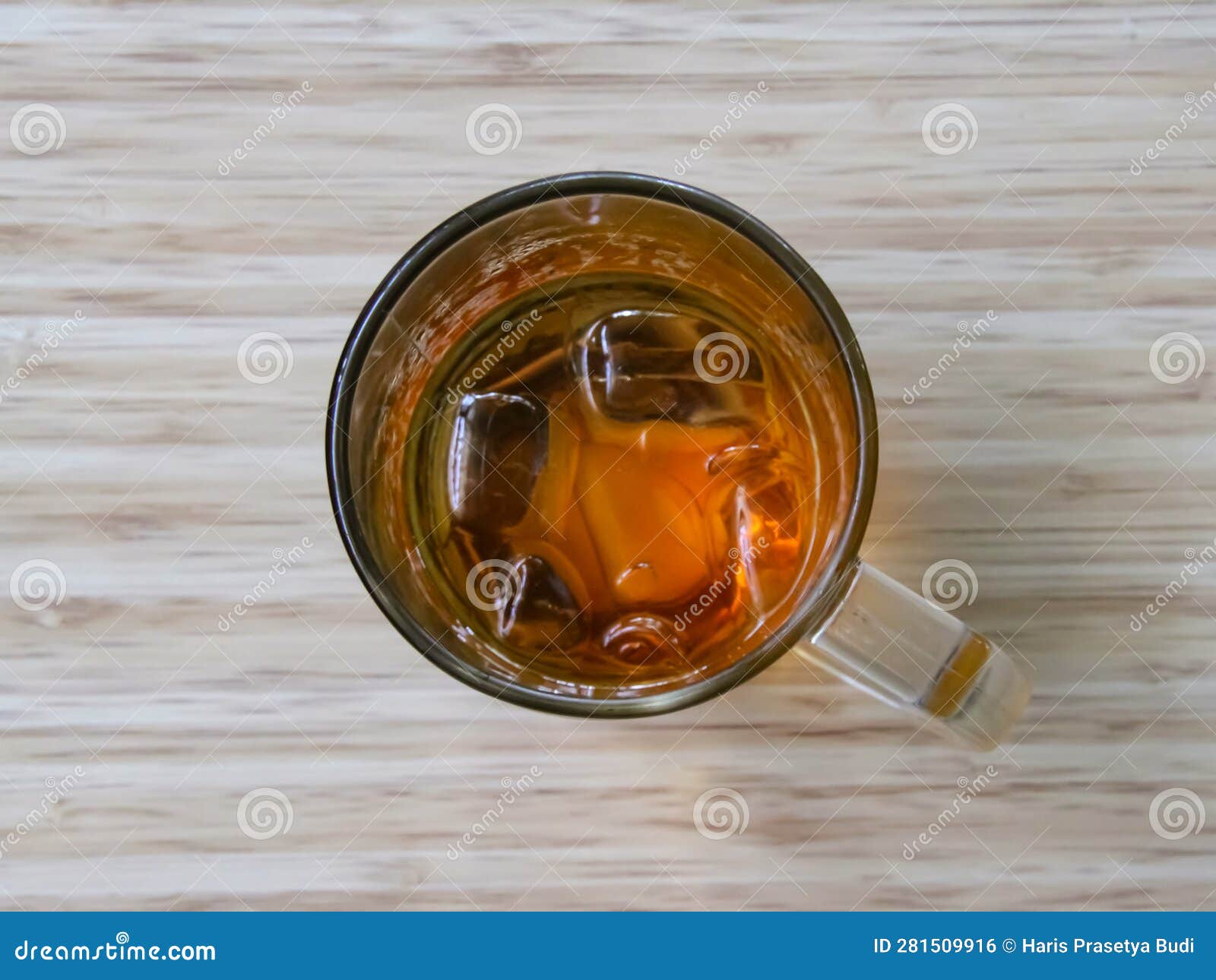 Close Up Shot of a Glass of Iced Tea on the Table. Top View Stock Photo