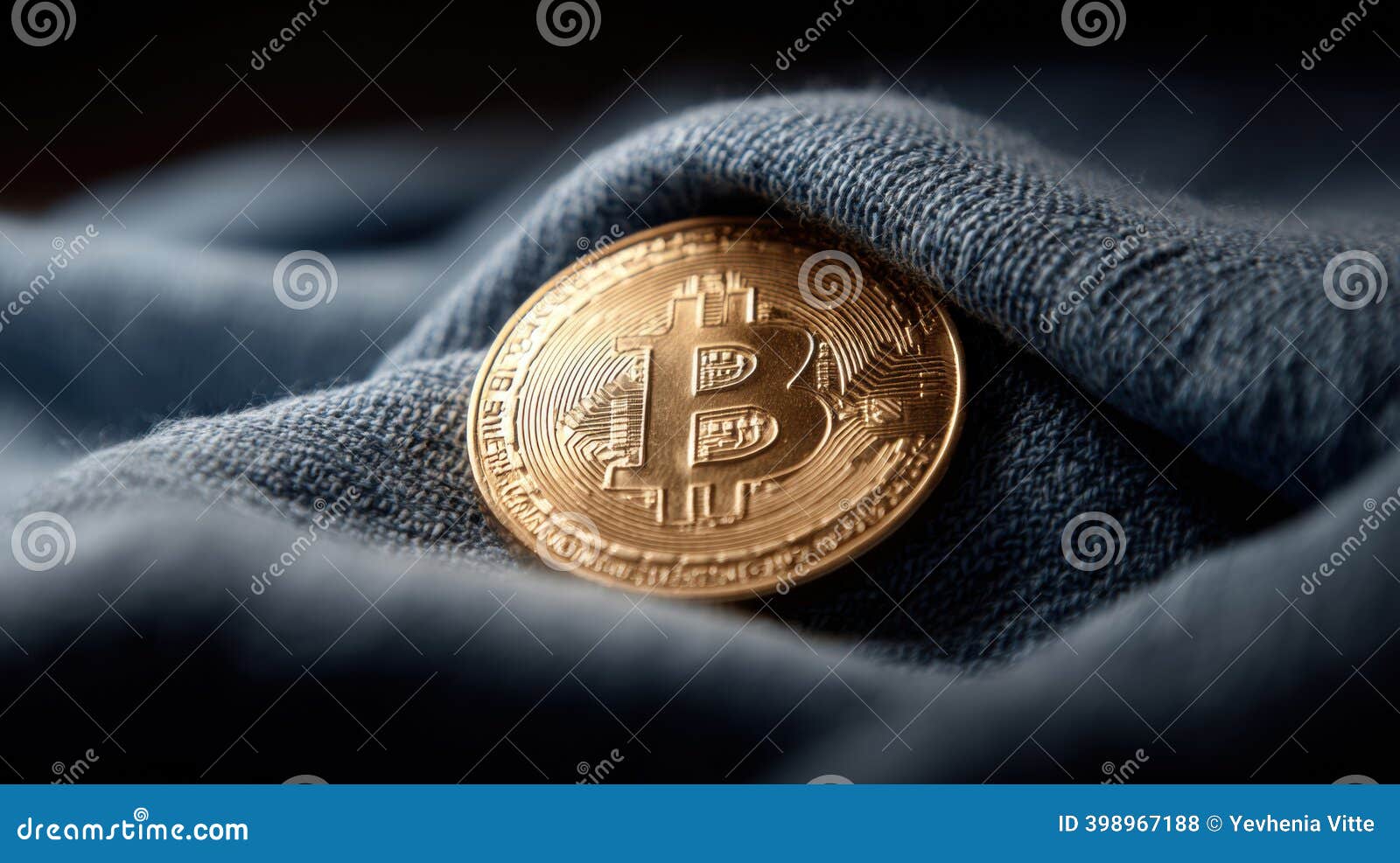 A Close-up Shot of a Golden Bitcoin Coin Resting on a Soft, Blue Denim  Fabric. Stock Photo - Image of crypto, financial: 398967188