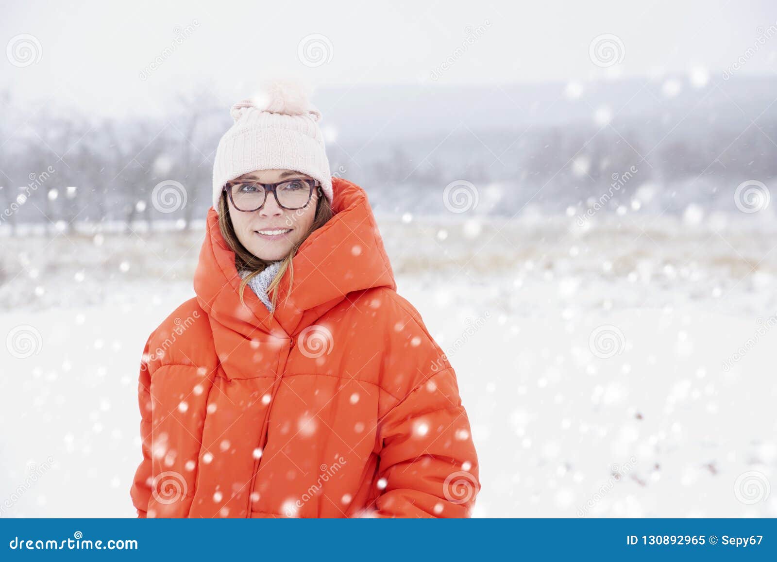 Woman in snowfall stock image. Image of beautiful, holiday - 130892965