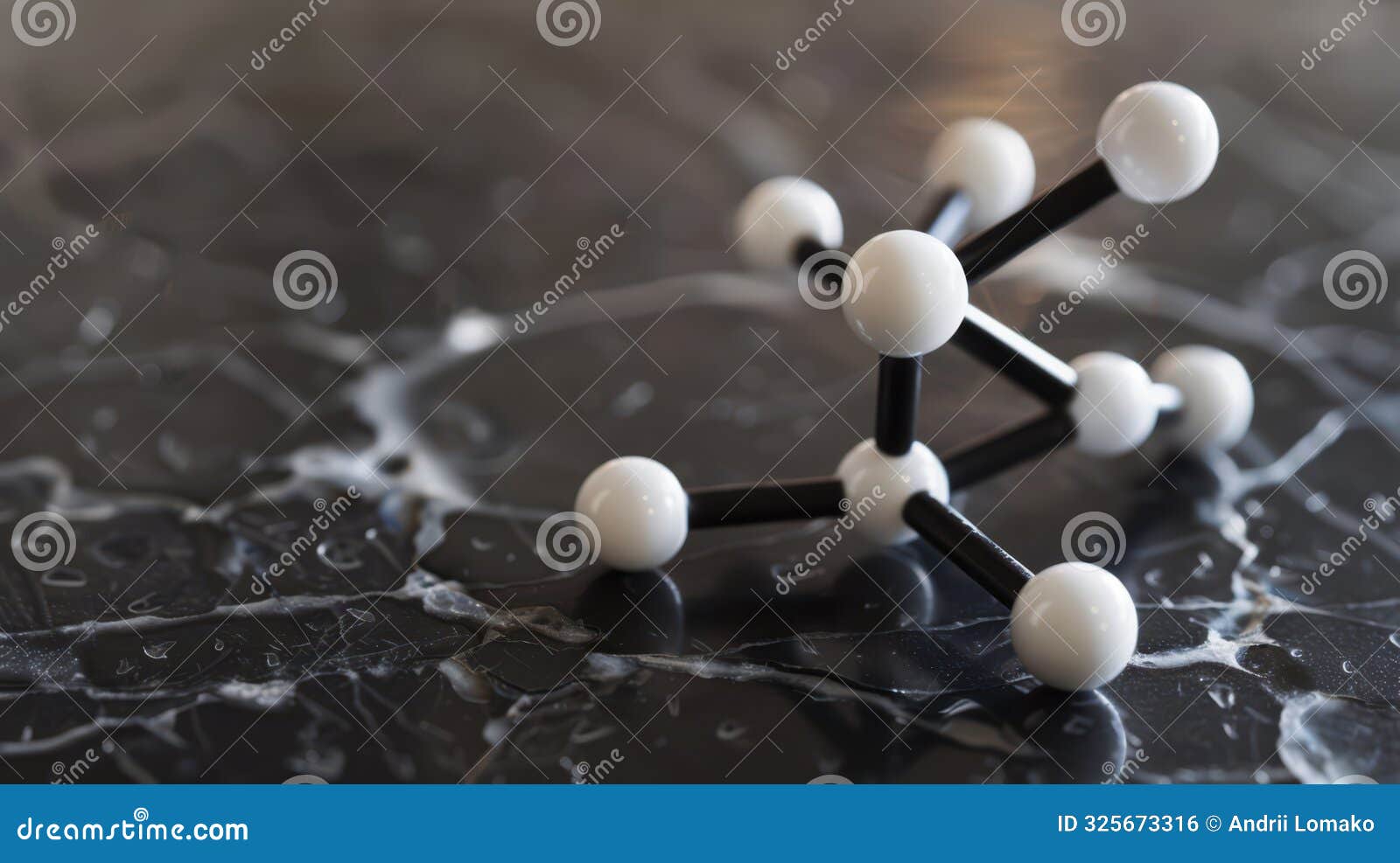 black and white molecular model on a marble surface