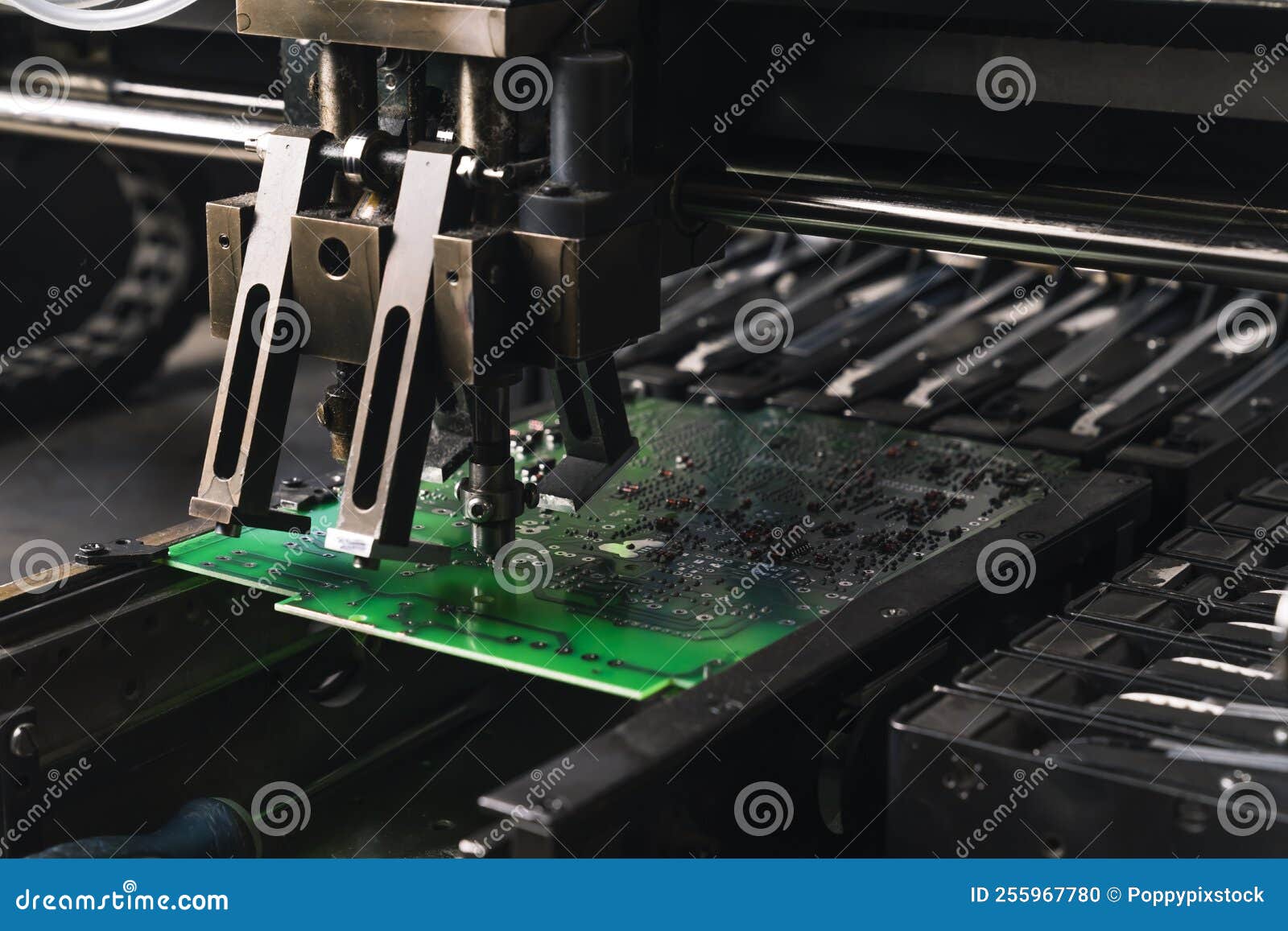 close-up shot of smd surface-mount device working on printed circuit board pcb. assembling electrical components