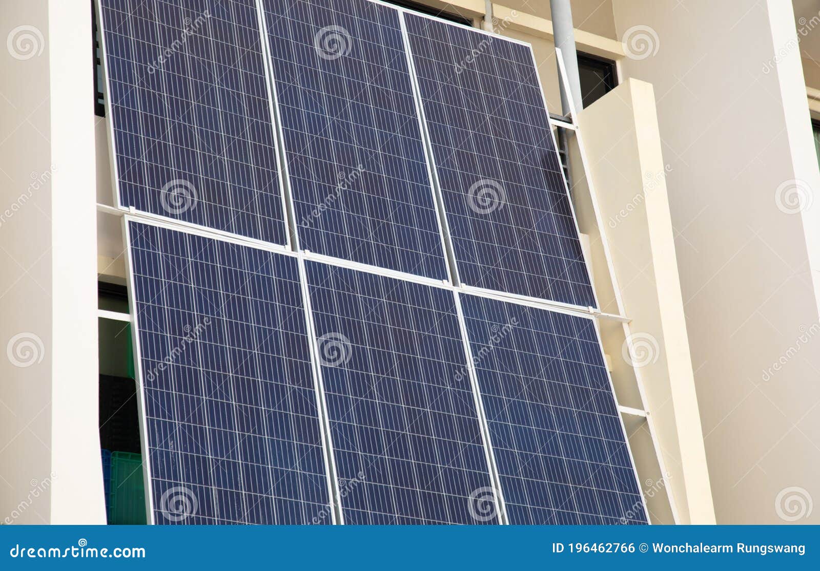 Close Up Shot of Solar Cell Panel System Vertically Placed on the House