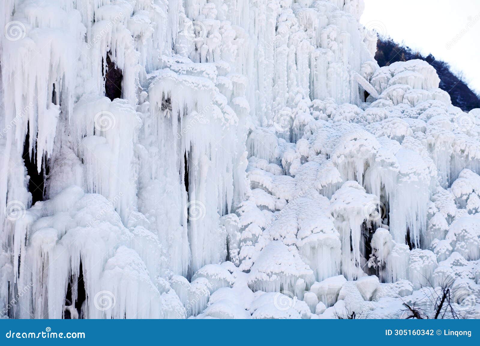 close-up shot of a spectacular icefall in the mountain area.