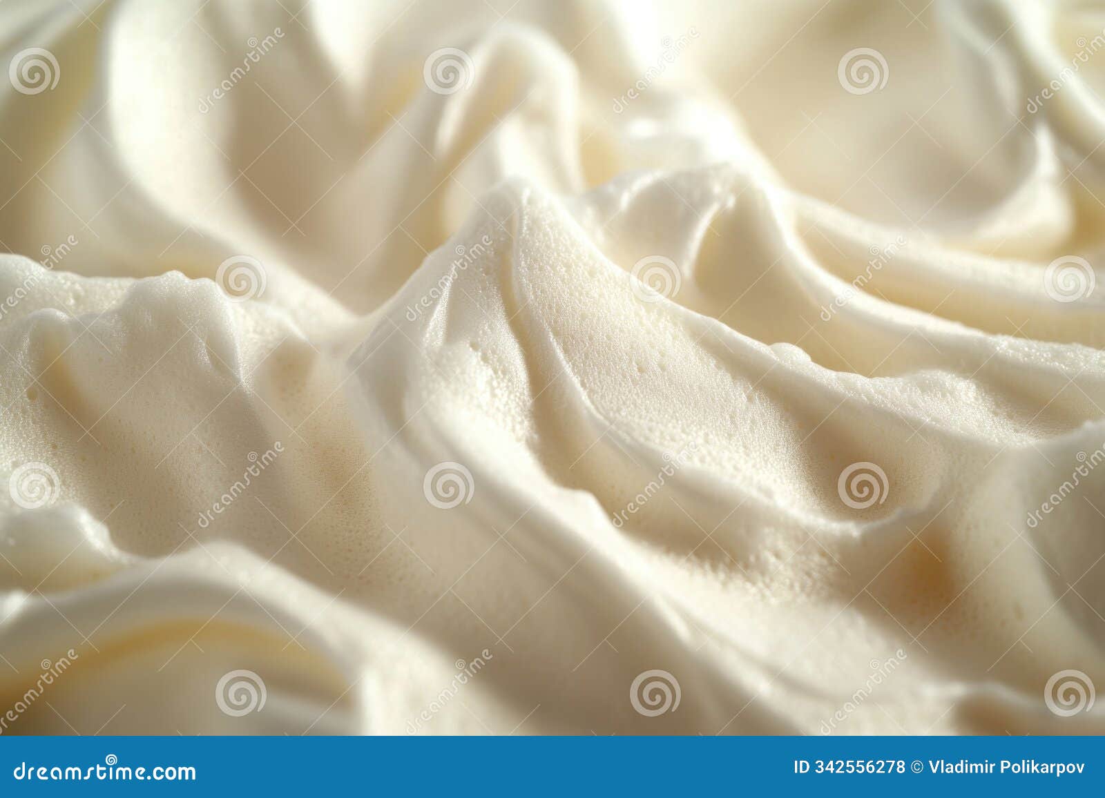 close-up shot of white frosting on a cake, perfect for food, baking, or dessert themed projects