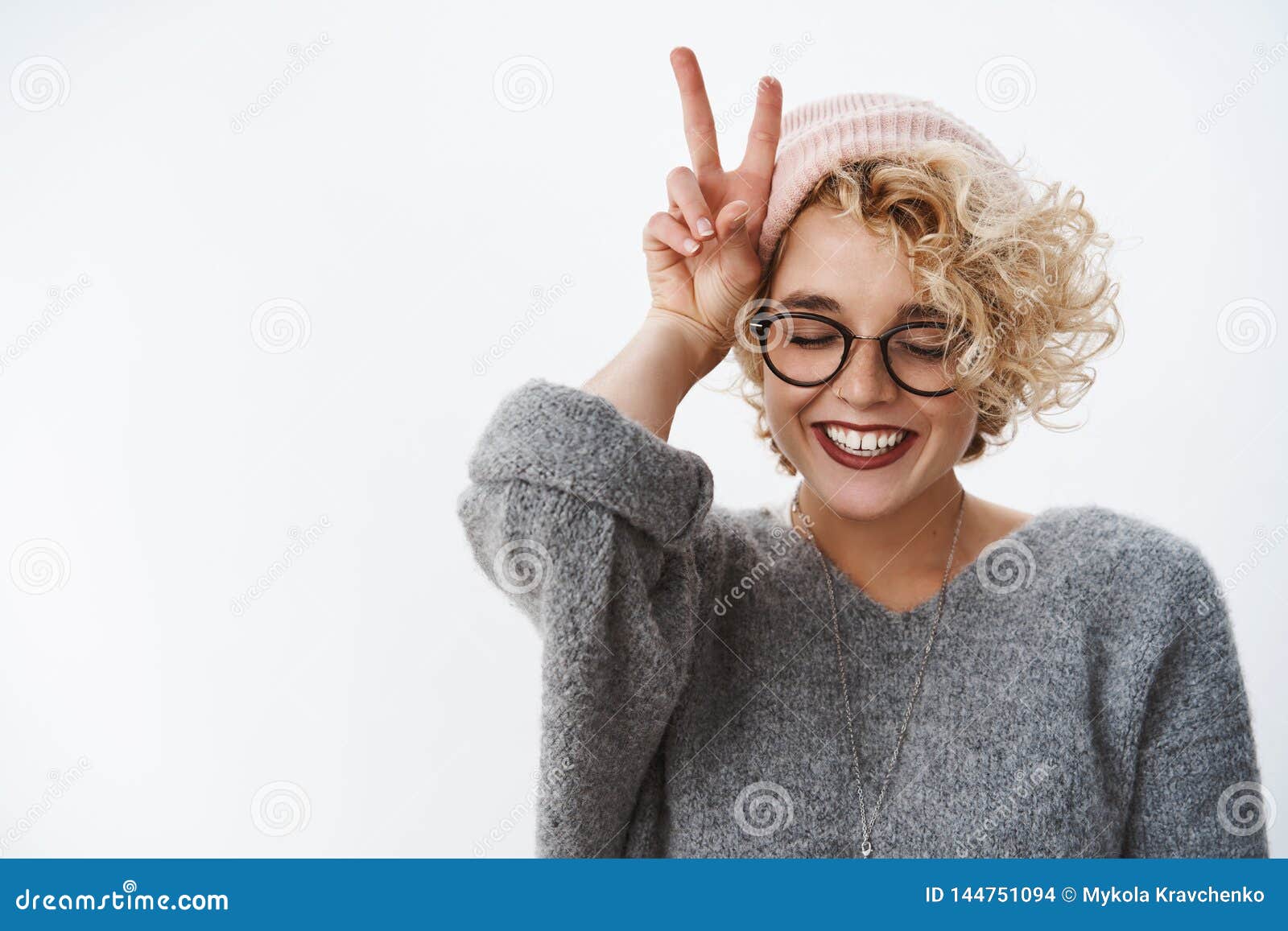 close-up shot of woman loving winter and holidays having fun feeling happy and tender close eyes joyful wearing beanie