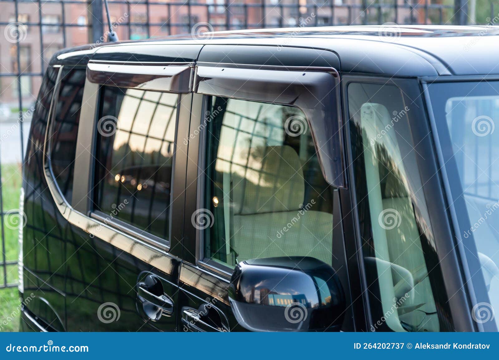 Closeup of the Side Windows of a Car Sedan with Plastic Darkened Pads