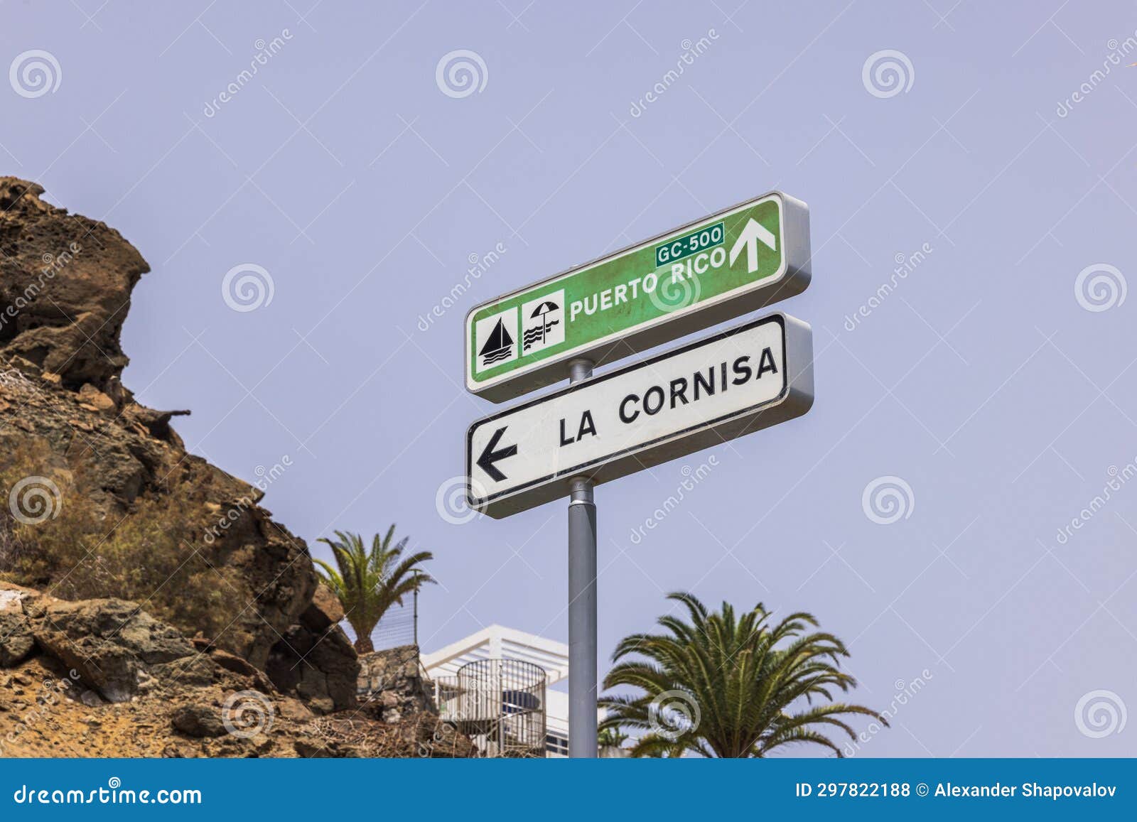 close-up of signs indicating direction to puerto rico beach and highway towards la cornisa on island of gran canaria.