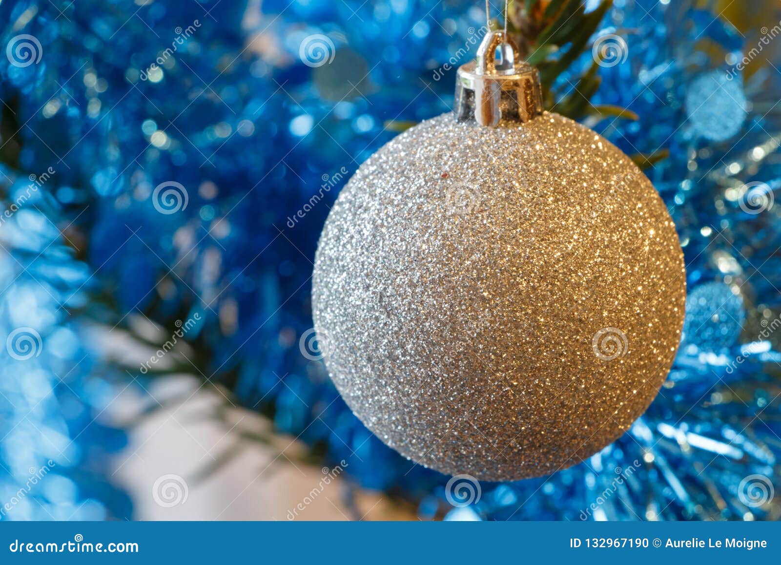 Silvery Christmas Balls and Blue Tinsel on a Christmas Tree Stock Photo ...