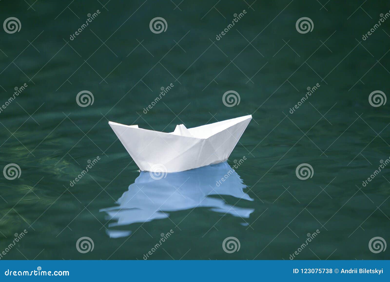 Close-up Of Simple Small White Origami Paper Boat Floating ...