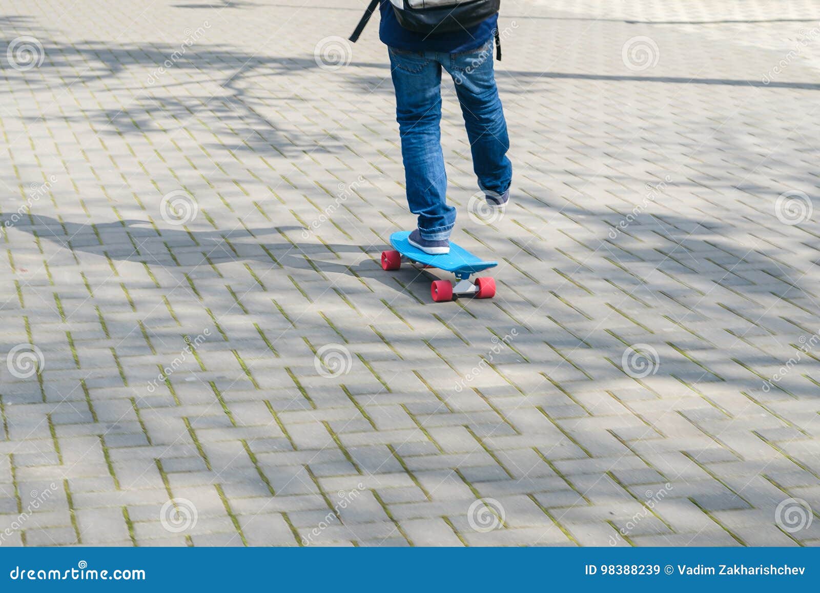 Close Up of Skateboarder Feet while Skating in the Park Stock Image