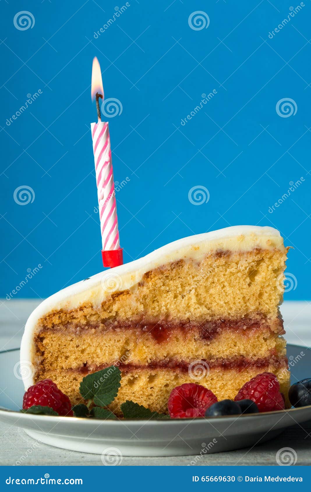 Close Up of a Slice of Birthday Cake with Candle Stock Photo Image of