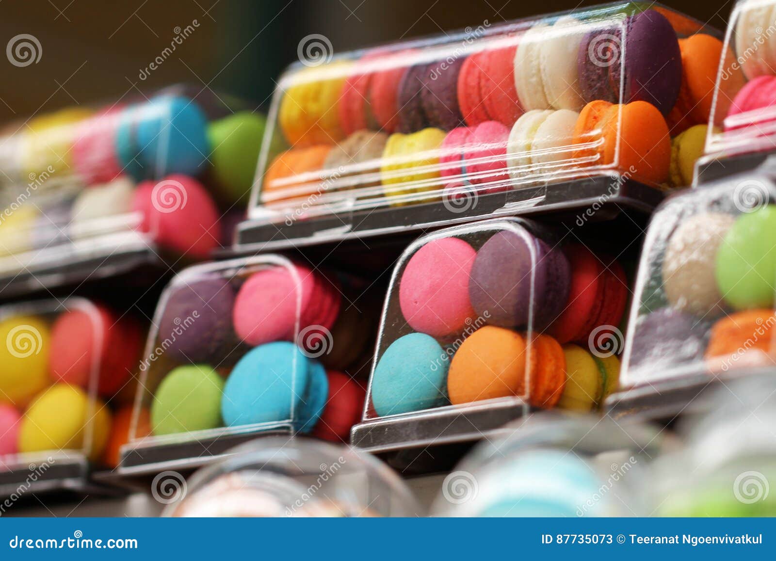 Close-up Small French Colorful Macarons in Glossy Plastic Container in ...