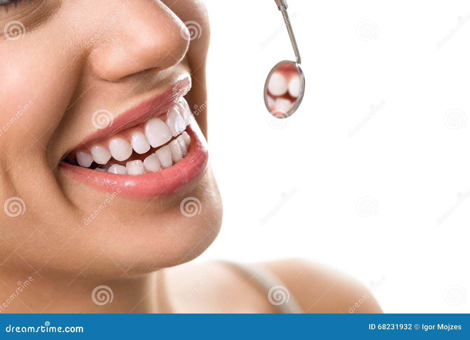 close-up of smile patient with healthy tooth with dental mirror