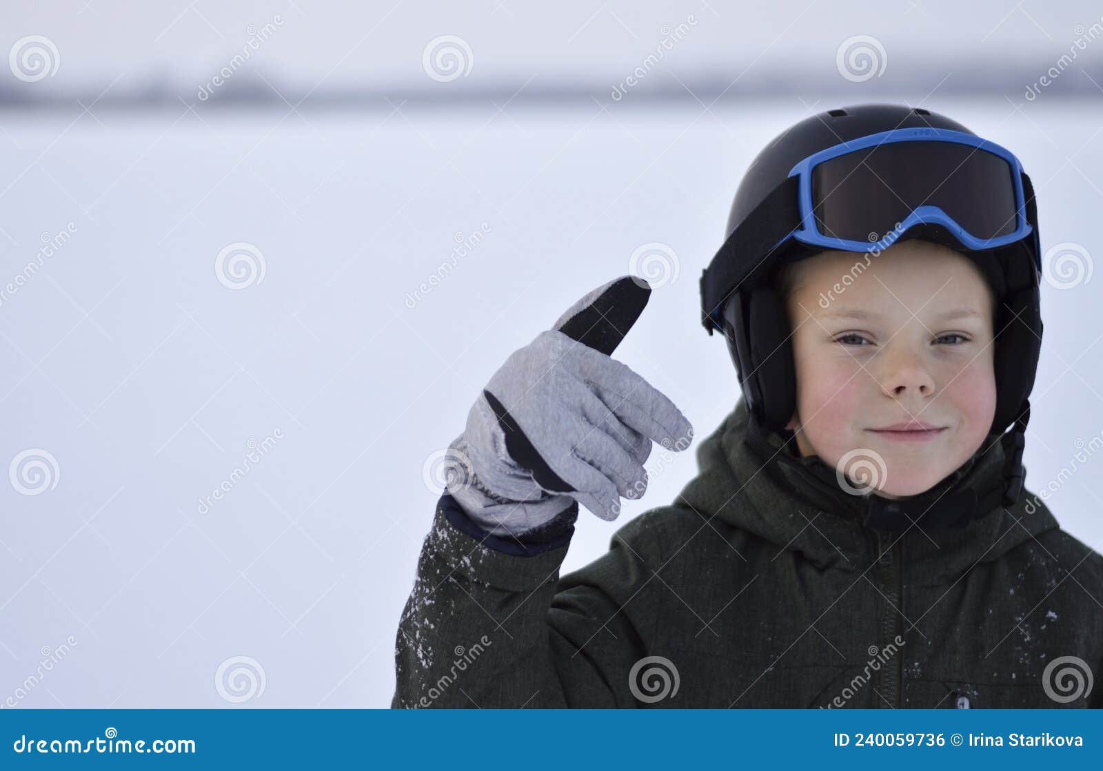 Closeup of Smiling Boy Wearing Ski Mask in Winter Stock Photo Image