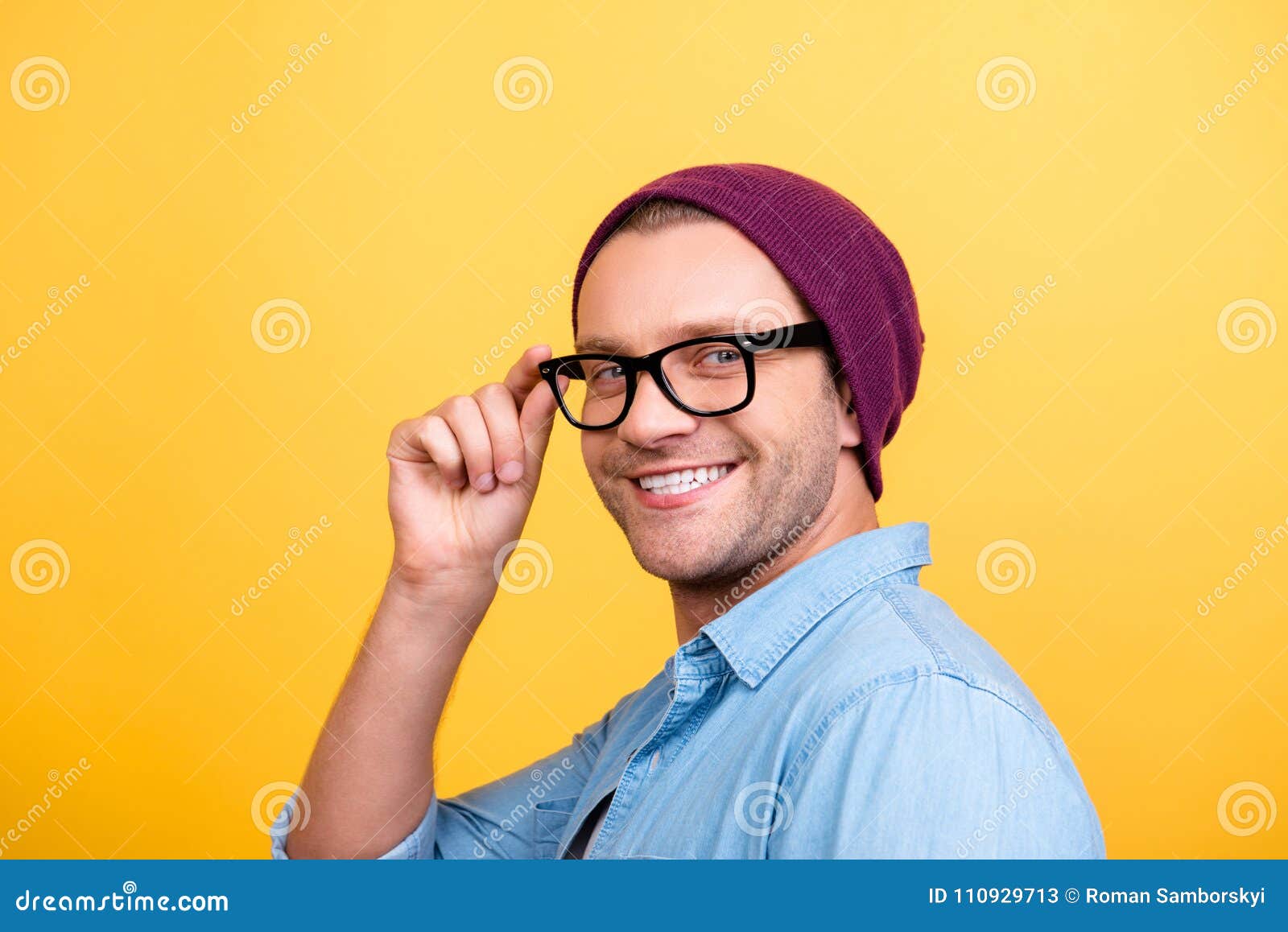 Close Up of Smiling Guy in Violet Cap, Looking at Camera, Holding ...