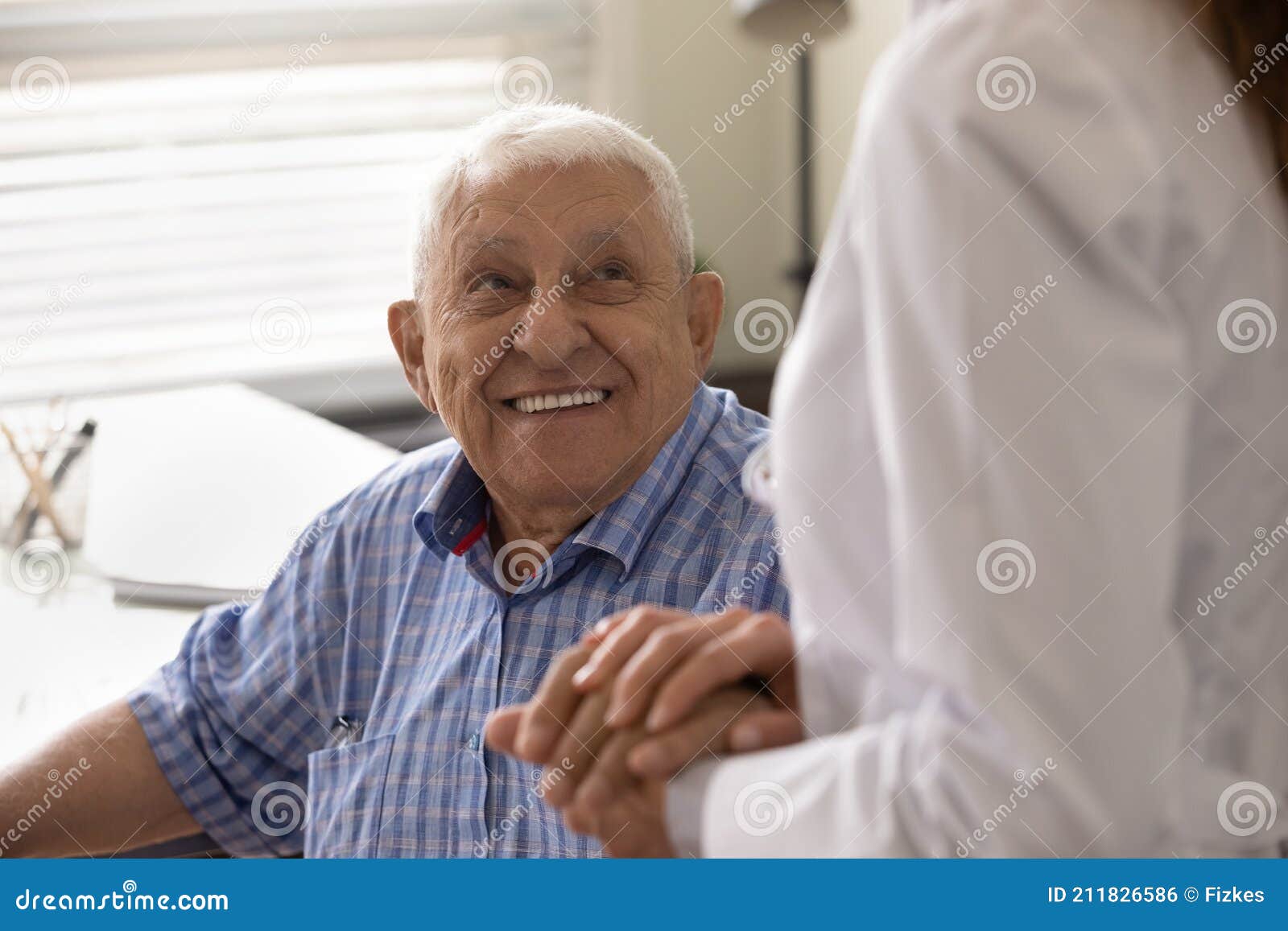 Close Up Smiling Mature Man and Caregiver Holding Hands Stock Photo ...