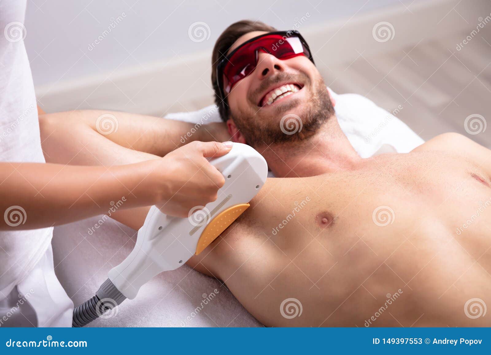 Young Man Having Underarm Laser Hair Removal Treatment Stock Image - Image  of lying, epilator: 149397553