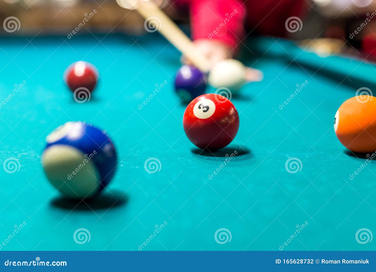 Closeup of Someone Aiming the Billiard Ball with Cue Stock Photo