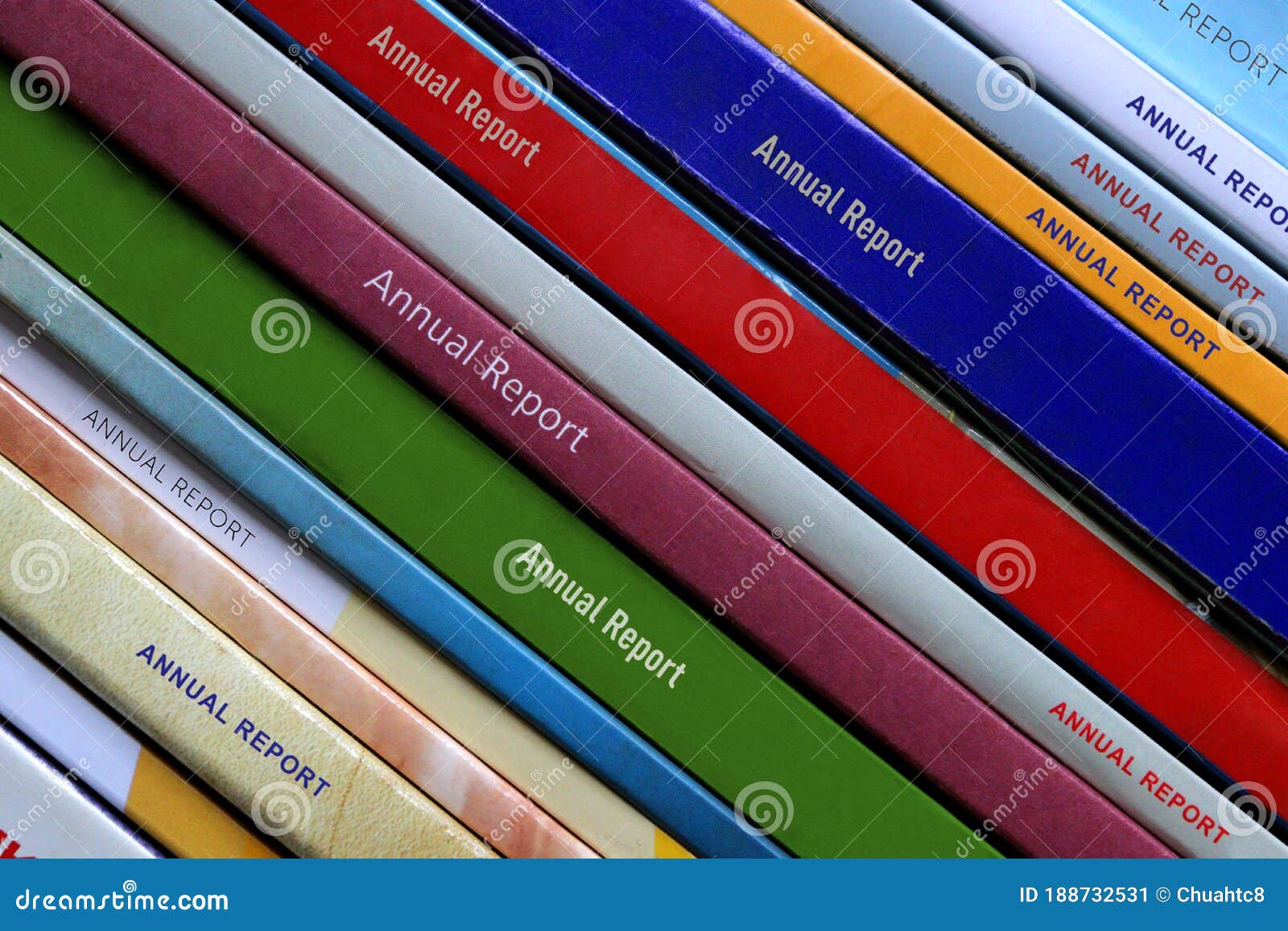 close-up on the spines of a set of corporate annual reports