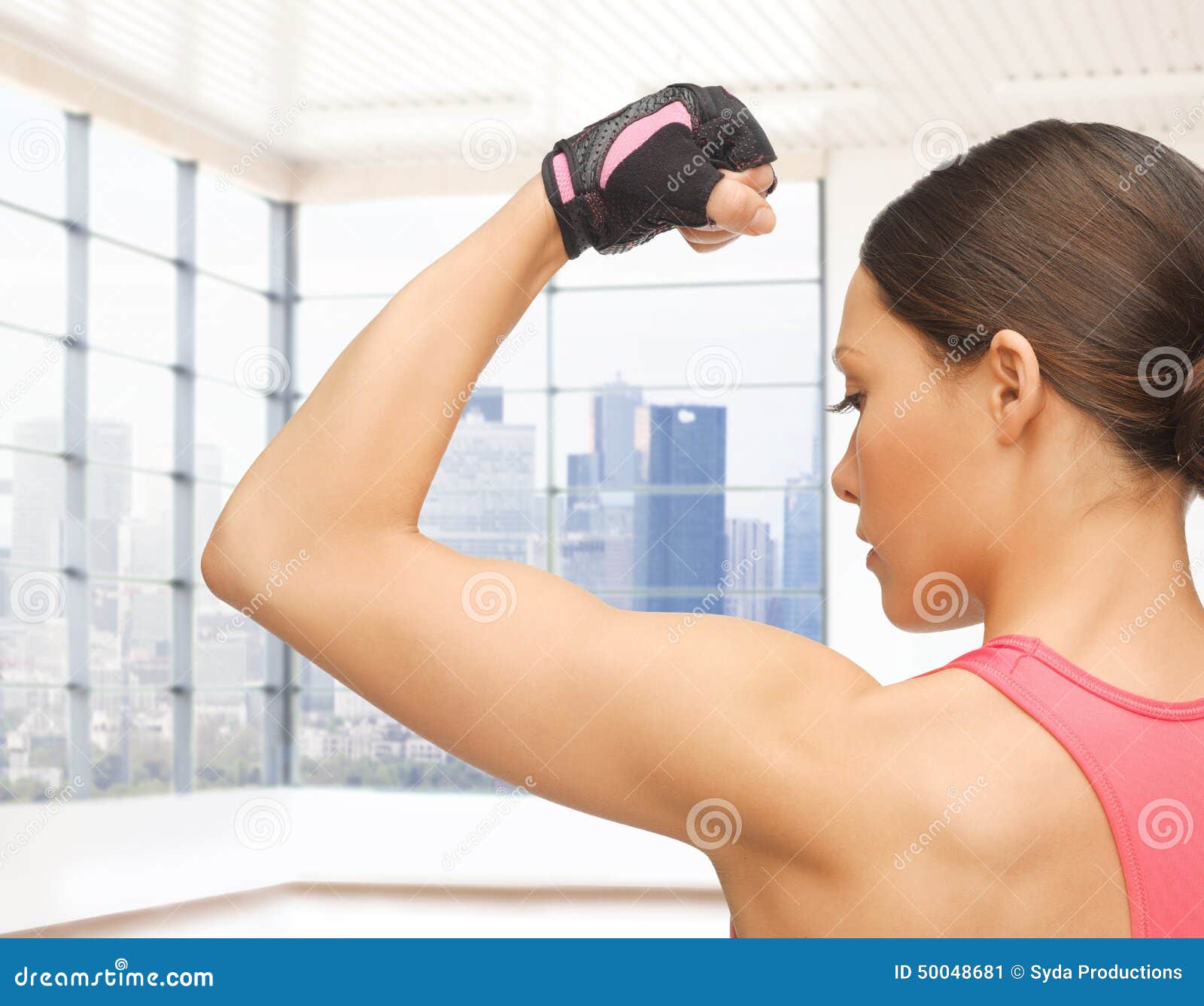 A Strong Muscular Woman Flexing Her Muscles. Beautiful Woman Isolated On A  White Background Stock Photo, Picture and Royalty Free Image. Image  42136010.