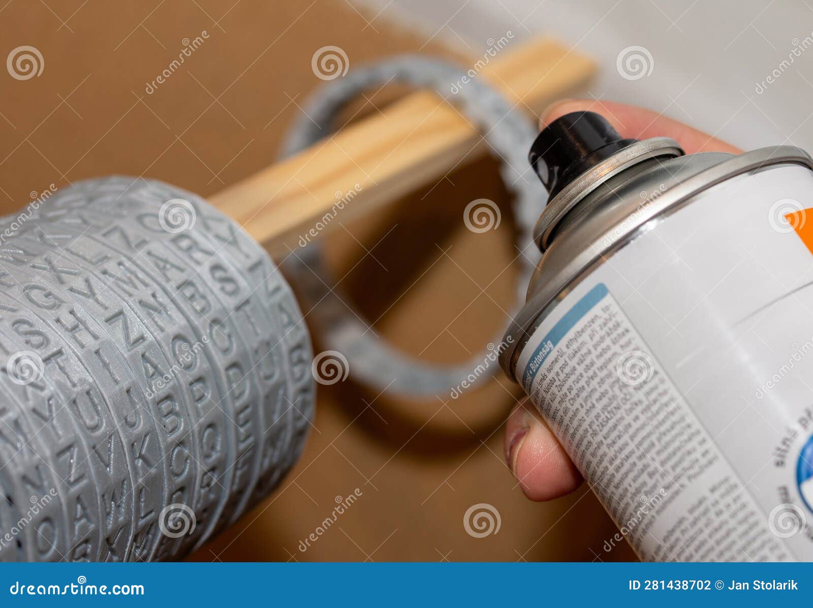 Closeup of Spray Painting of Plastic Parts Printed on a 3D Printer