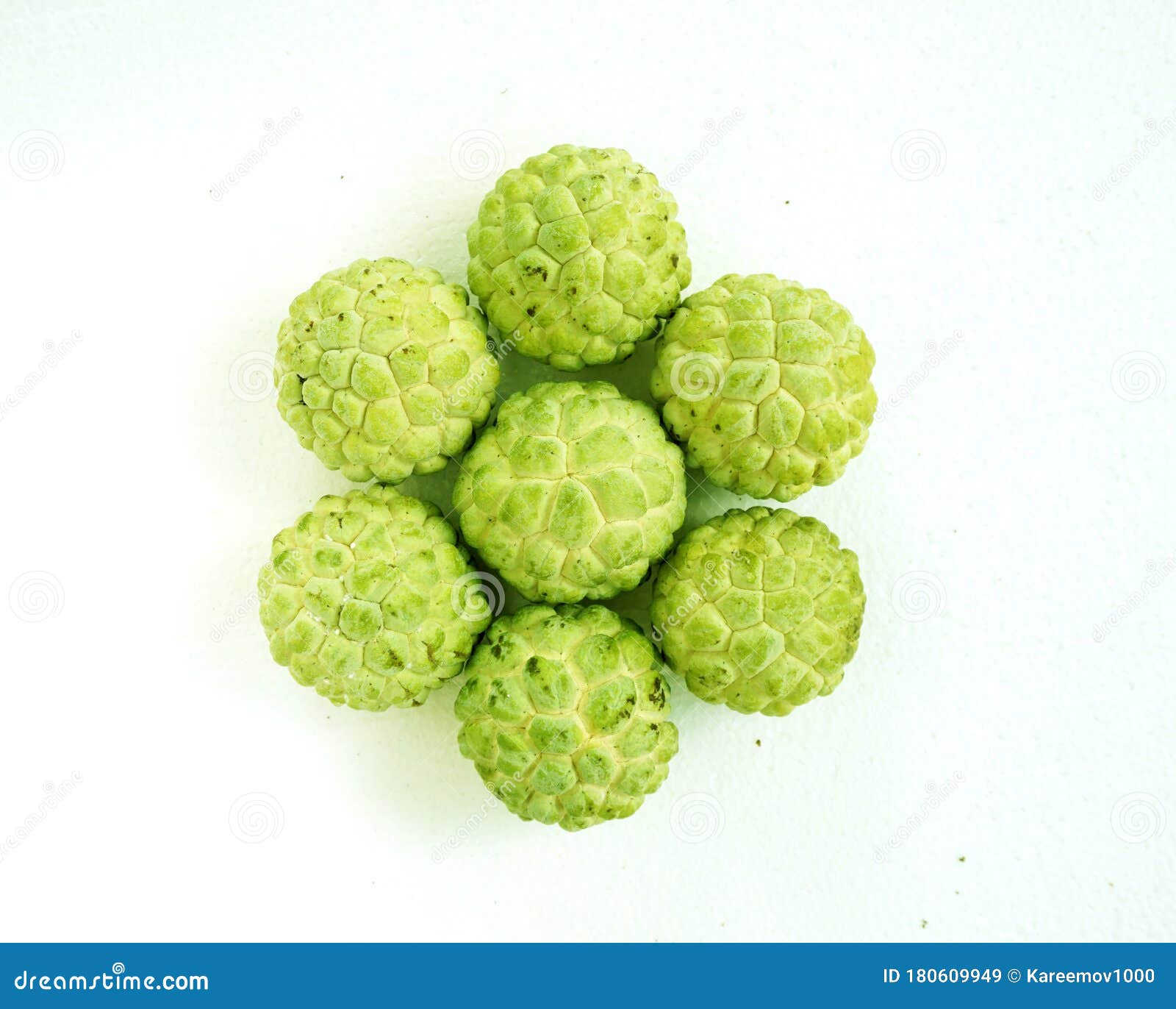 srikaya fruit annona squamosa with leaves, from top view,  white background.
