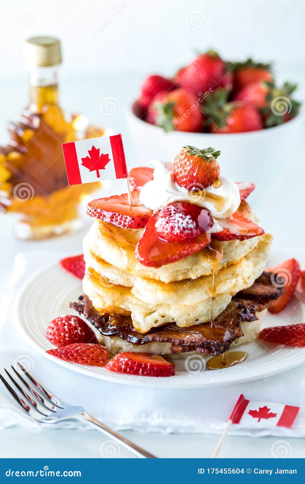 Close Up of a Stack of Pancakes with Strawberries and Maple Syrup for