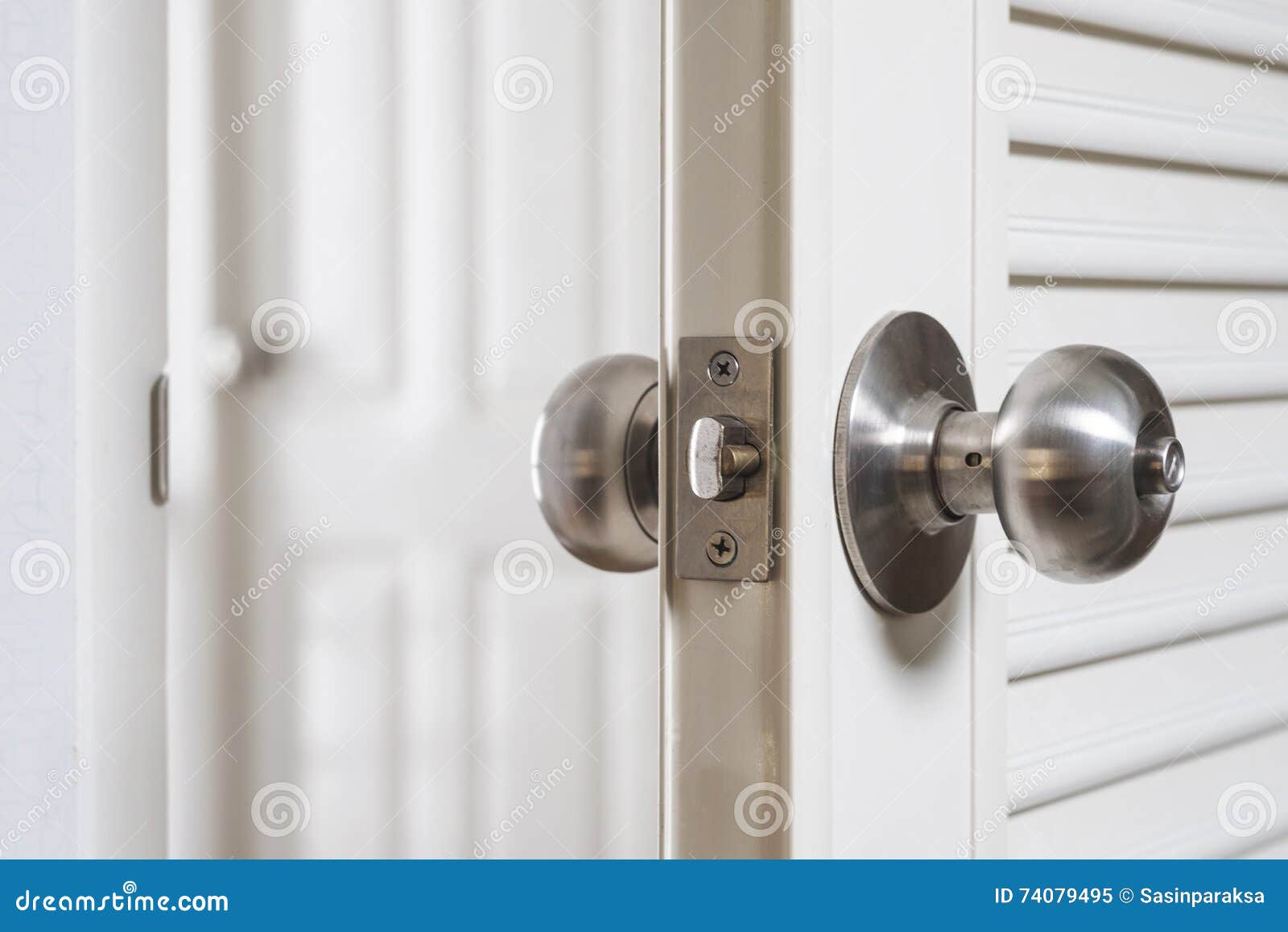 Closeup Stainless Door Knob, with Door Open Slightly Stock Image