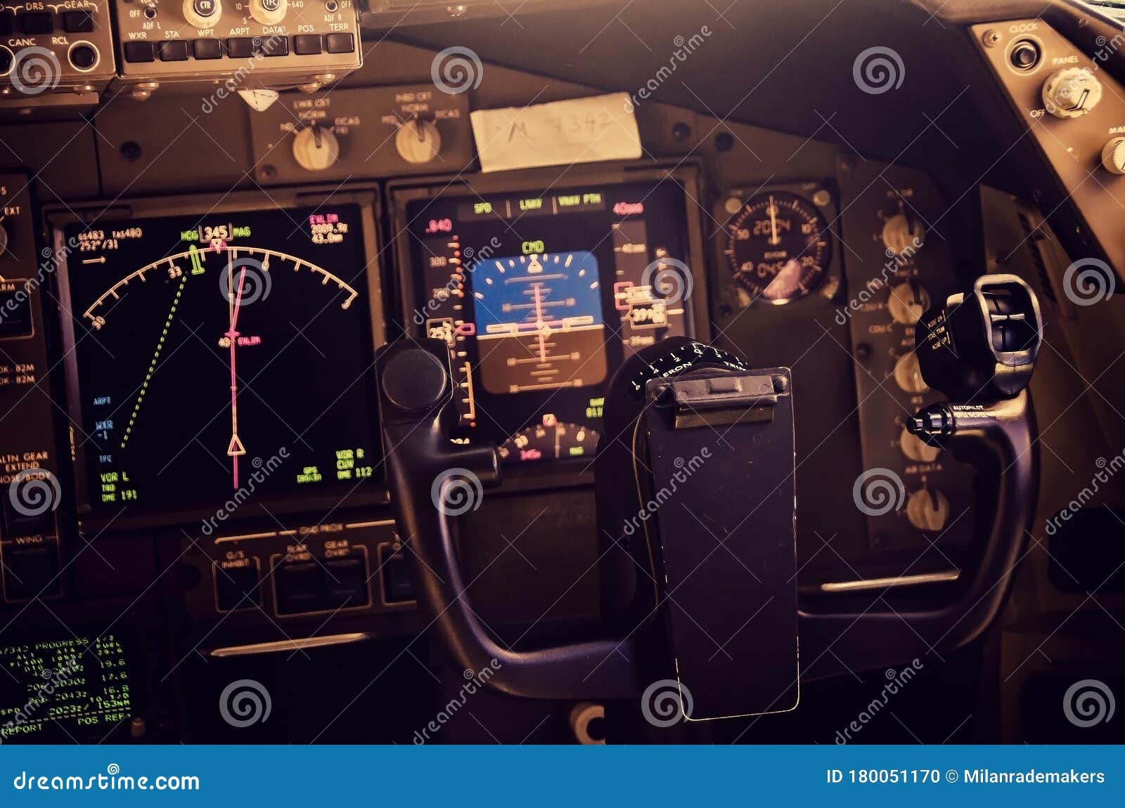 Close Up of the Steering Yoke of an Airplane with the Flight Instruments in the Background Stock