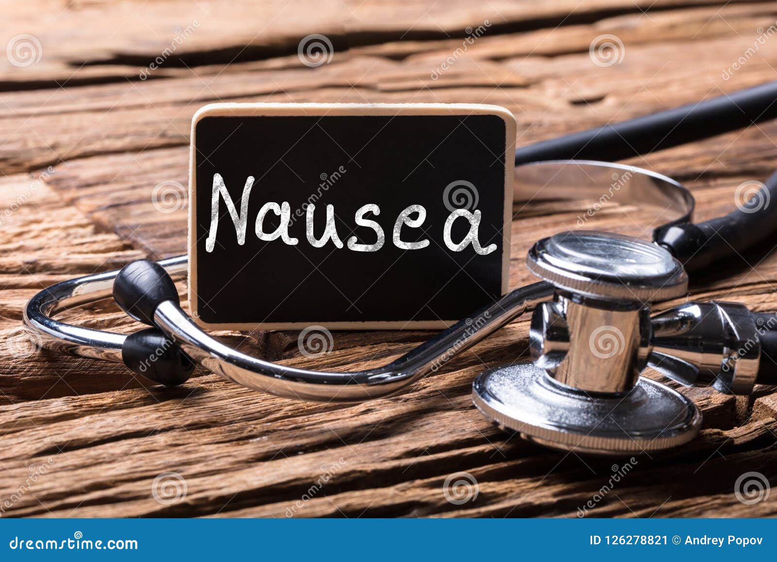 close-up of stethoscope with slate showing nausea text