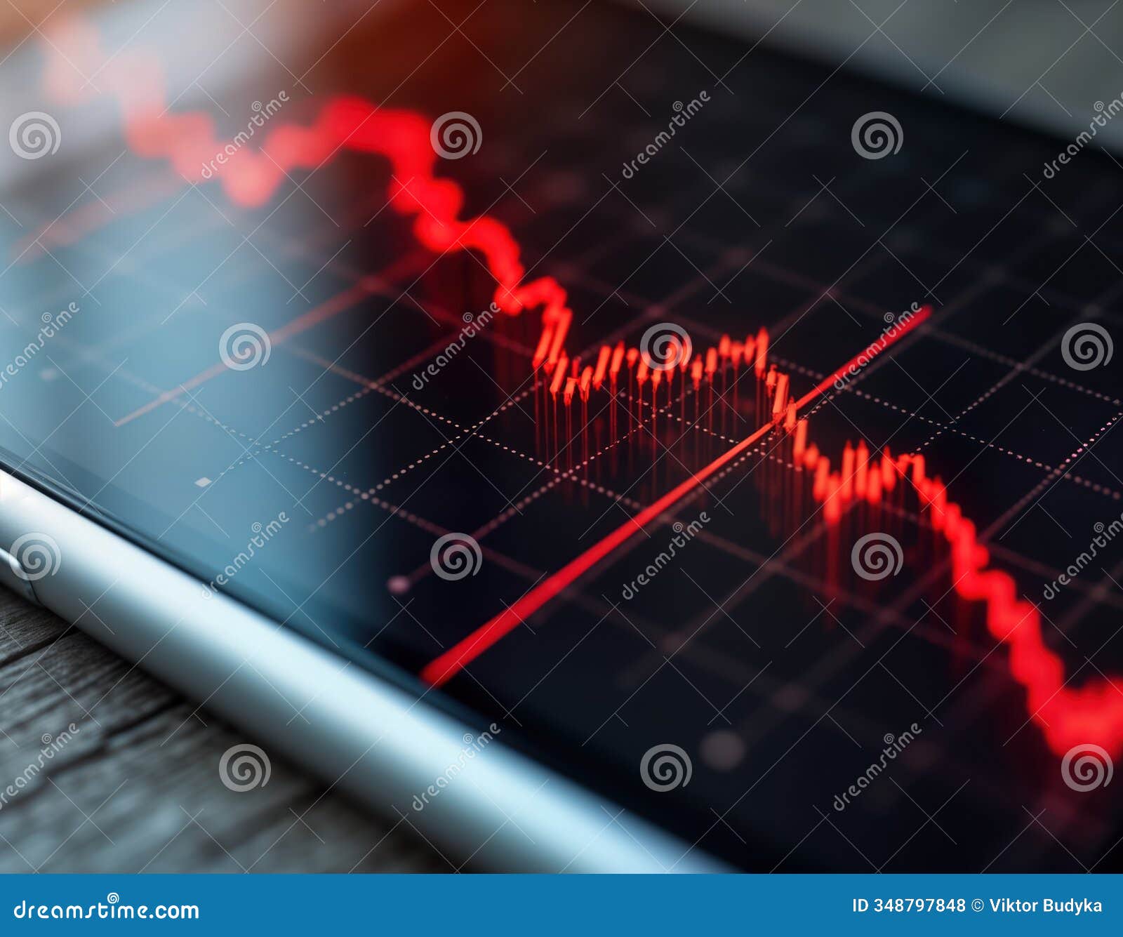 close-up stock chart on smartphone screen shows red market crash data. interactive real-time investment data displayed