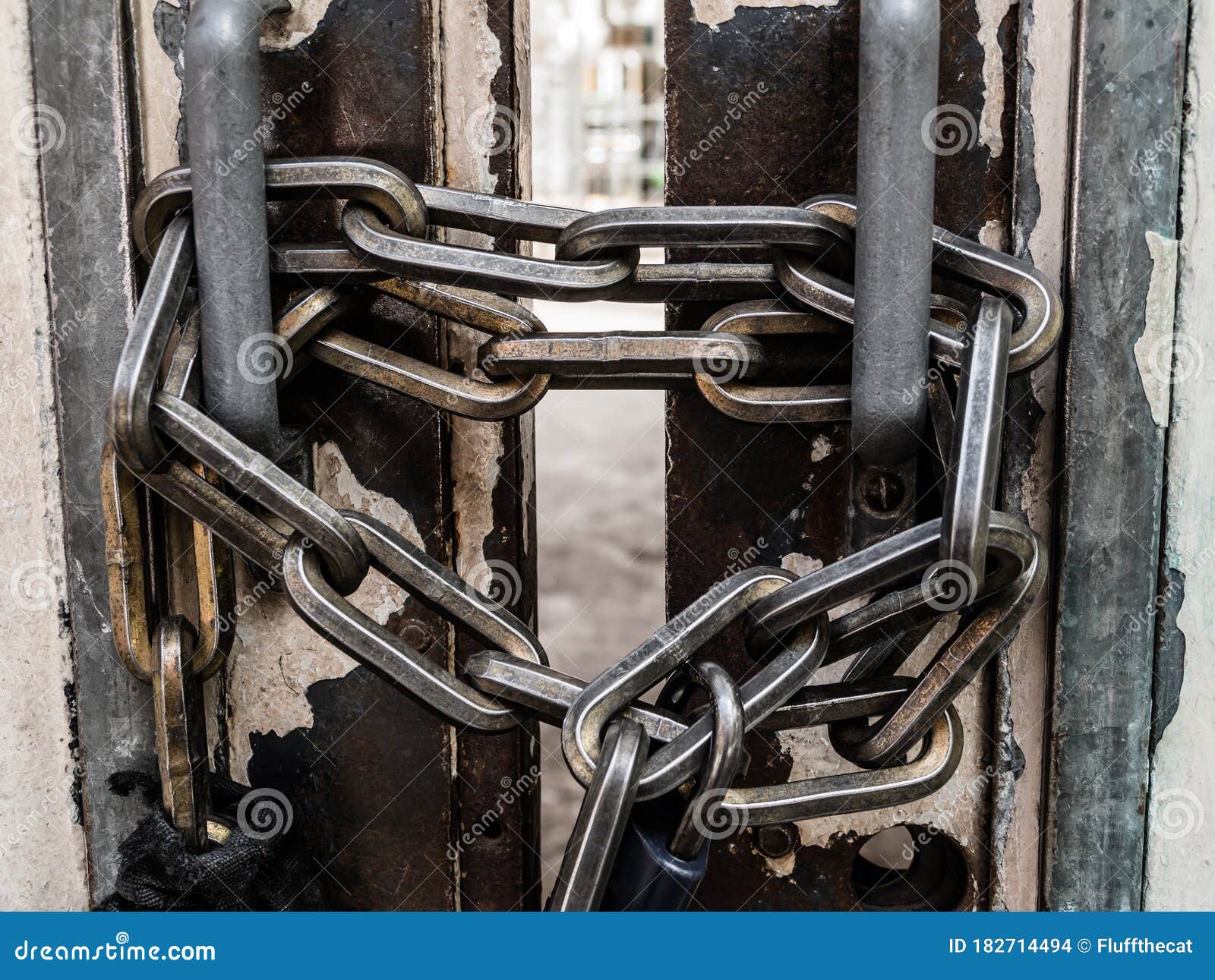 Closeup of Strong Metal Security Chains and Padlock. Stock Photo