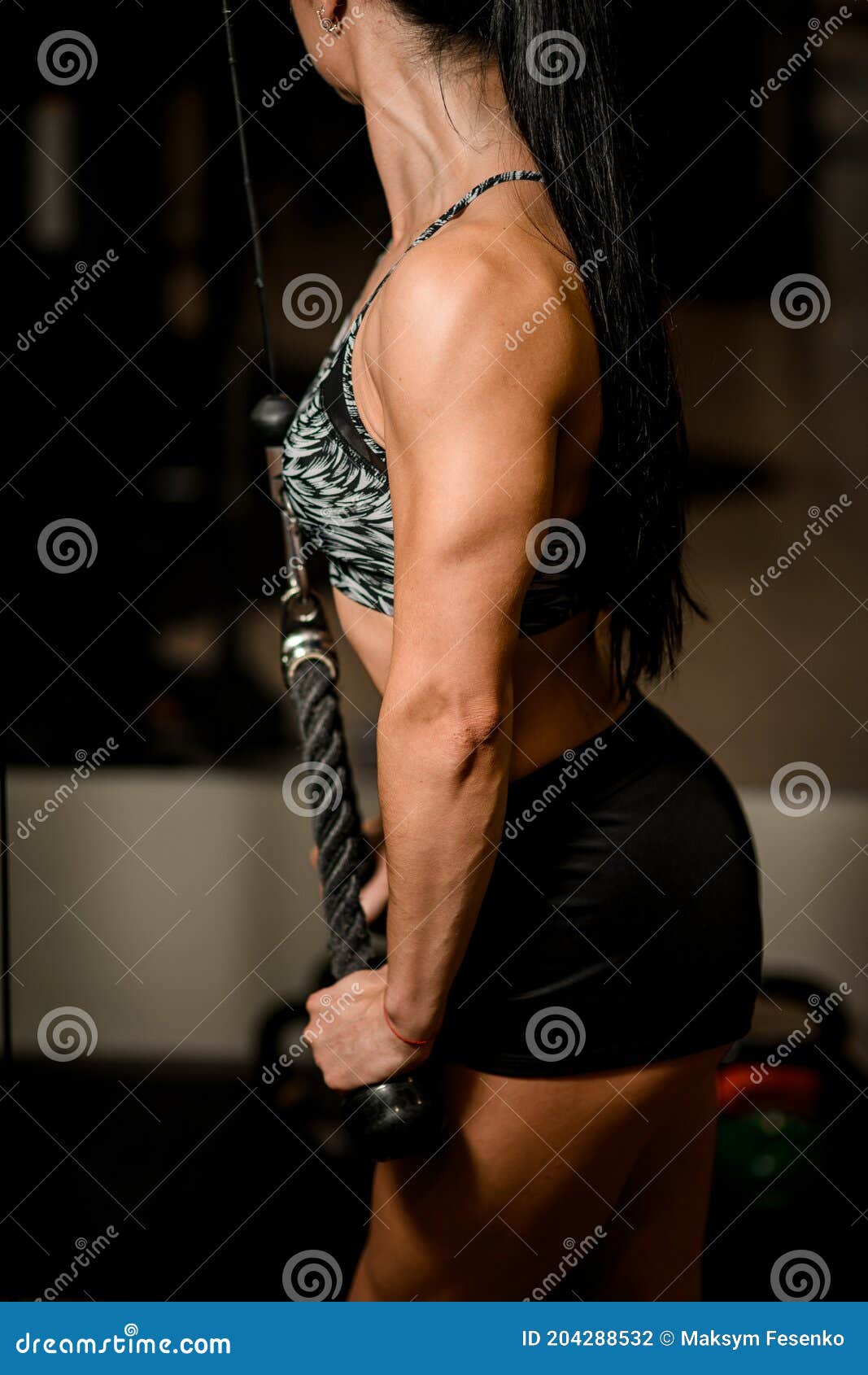 Close-up of Strong Muscular Arm of Woman Bodybuilder Who Train on
