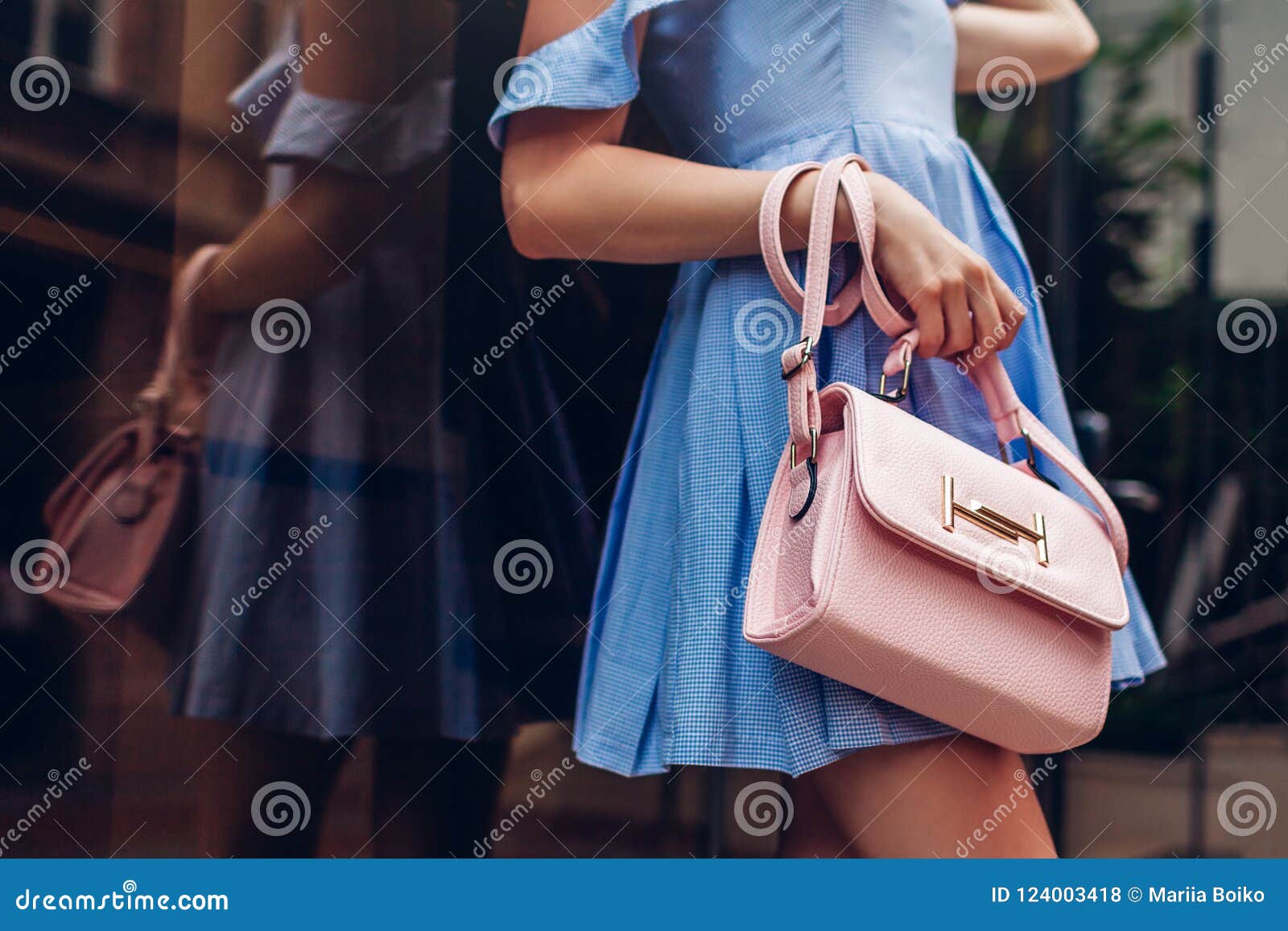 close-up of stylish female handbag. fashionable woman holding beautiful accessories outdoors.