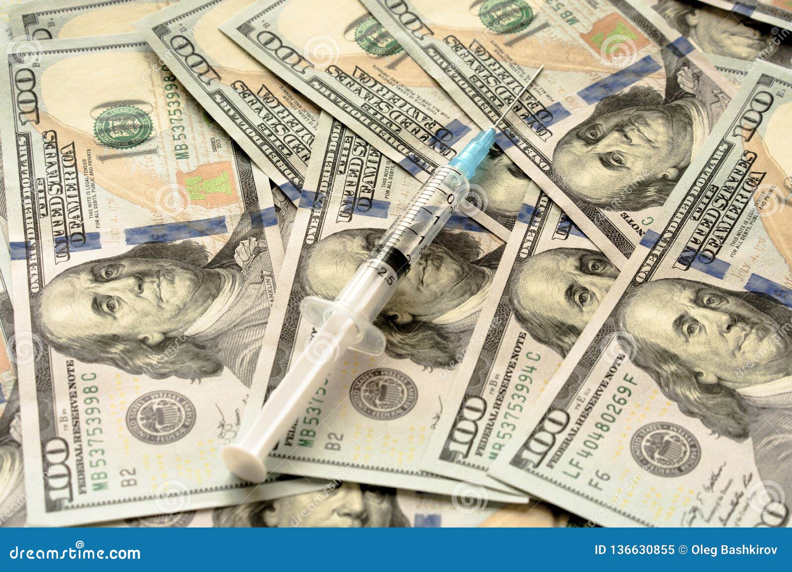 Close Up of Syringe with Injection on Dollar Banknotes Stock Image